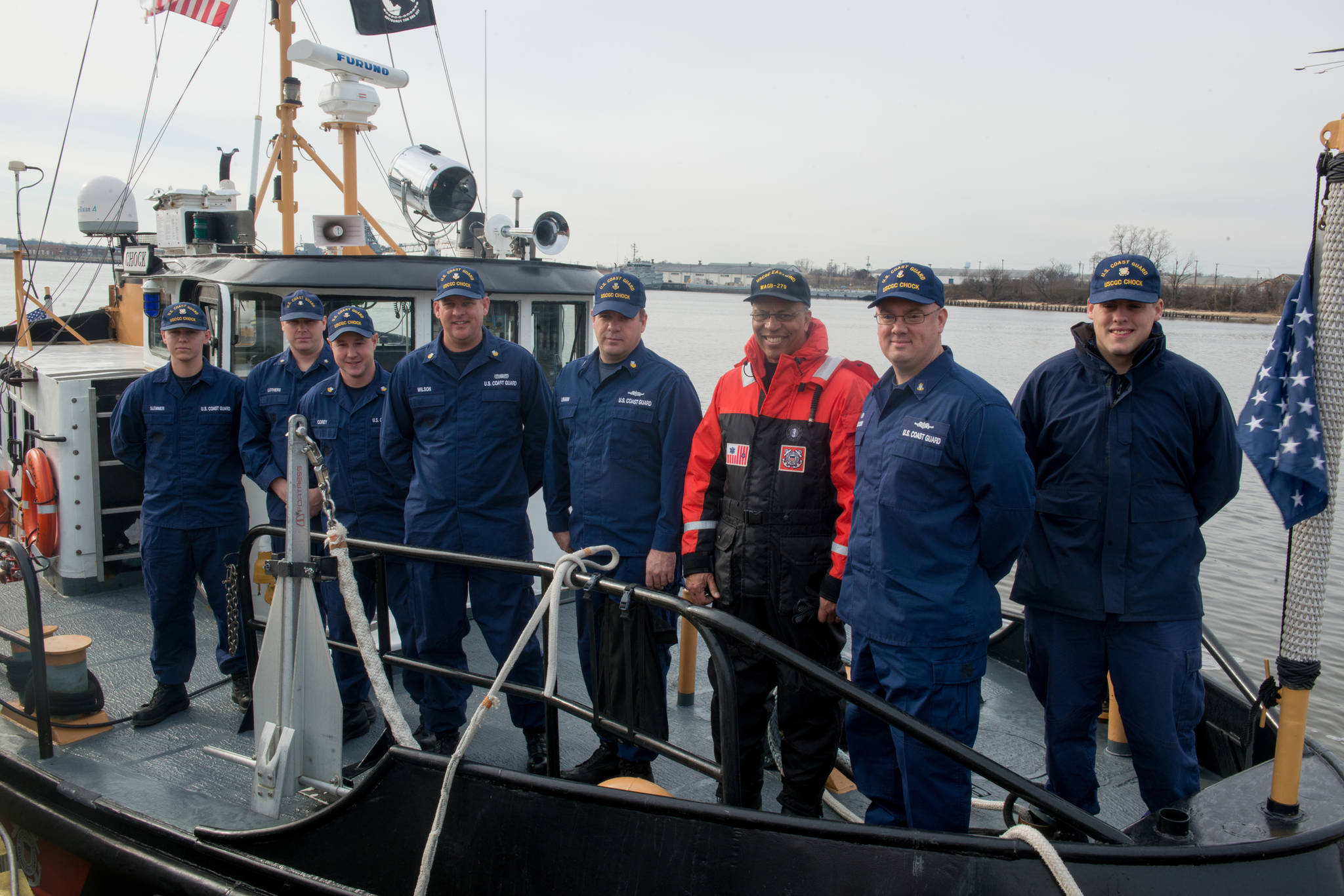 Lt. Gov. Boyd K. Rutherford (orange suit) poses with crew members of the Coast Guard Cutter Chock during the lieutenant governor’s visit aboard the cutter moored up at Curtis Bay in Maryland, Wednesday, Jan. 20, 2016. Rutherford visited with Coast Guard crews from Sector Baltimore, Station Curtis Bay and the cutter Chock. Chief Petty Officer Michael Kozloski, later promoted to Chief Warrant Officer, is second from right.(U.S. Coast Guard photo by Petty Officer David R. Marin)
