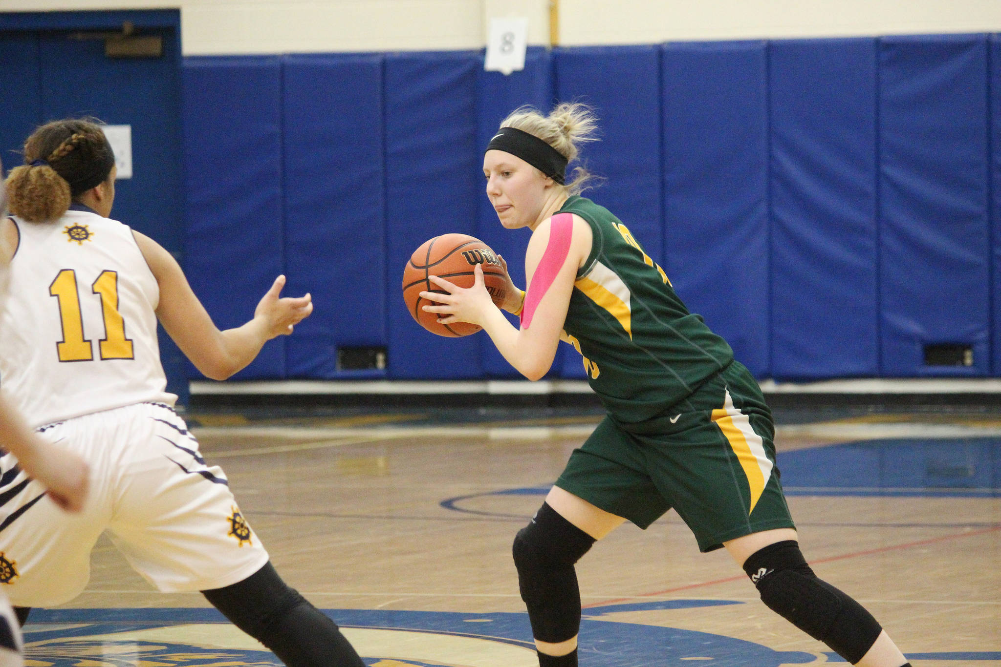 Seward’s Katelyn Lemme looks for a way around Homer’s Alia Bales on Friday, Feb. 8, 2019 during the Winter Carnival Basketball Tournament in Homer, Alaska. (Photo by Megan Pacer/Homer News)