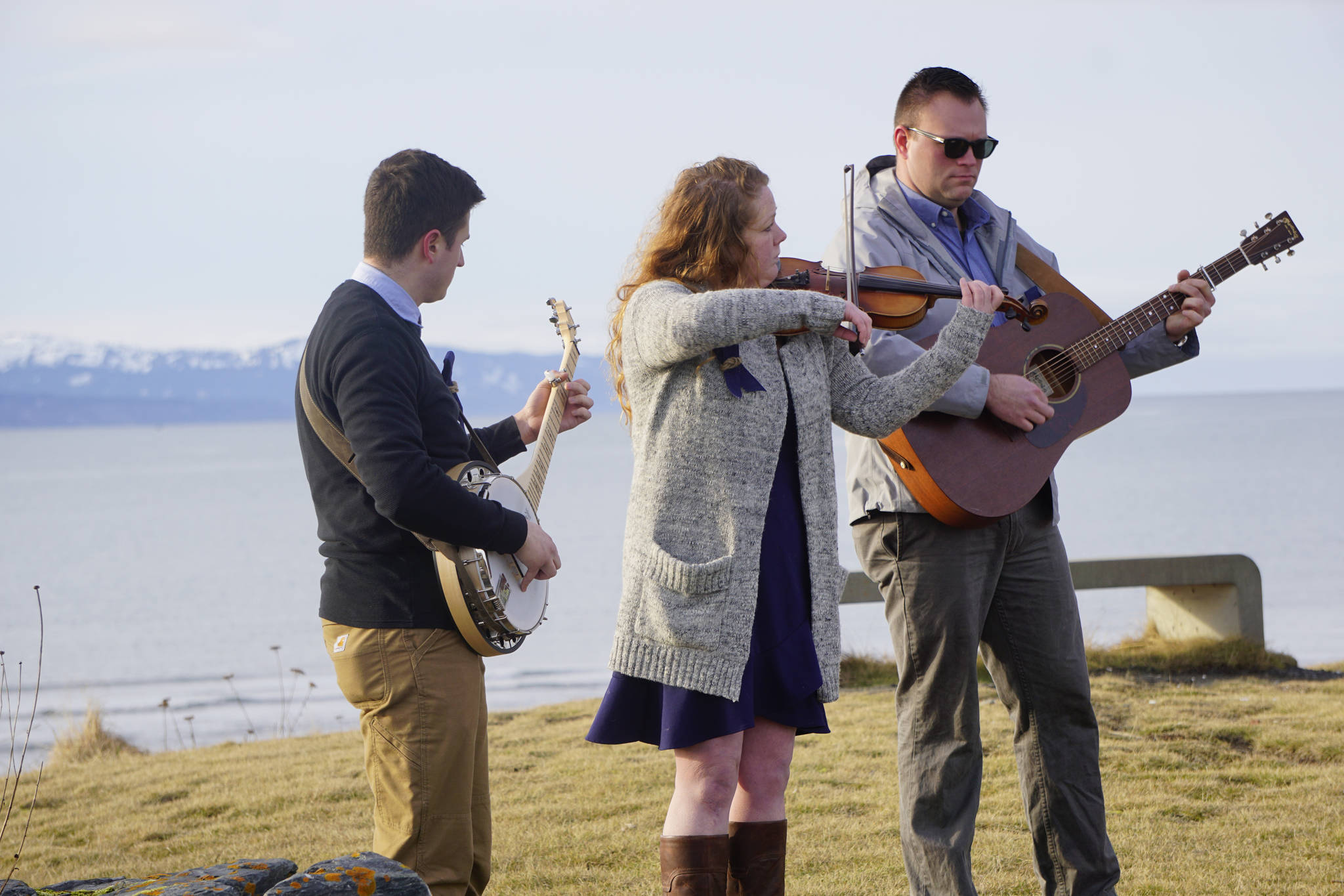 From left to right, Josh Kennedy, Kate Klann and Geddy Miller perform “I Bid You Goodbye” at a memorial service for Chief Warrant Officer Michael Kozloski on Friday morning, Feb. 8, 2019, at the Seafarer’s Memorial on the Homer Spit, Homer, Alaska. Kennedy served on the U.S. Coast Cutter Hickory with Kozloski and Miller is captain of the U.S. Coast Guard Cutter Naushon. (Photo by Michael Armstrong/Homer News)