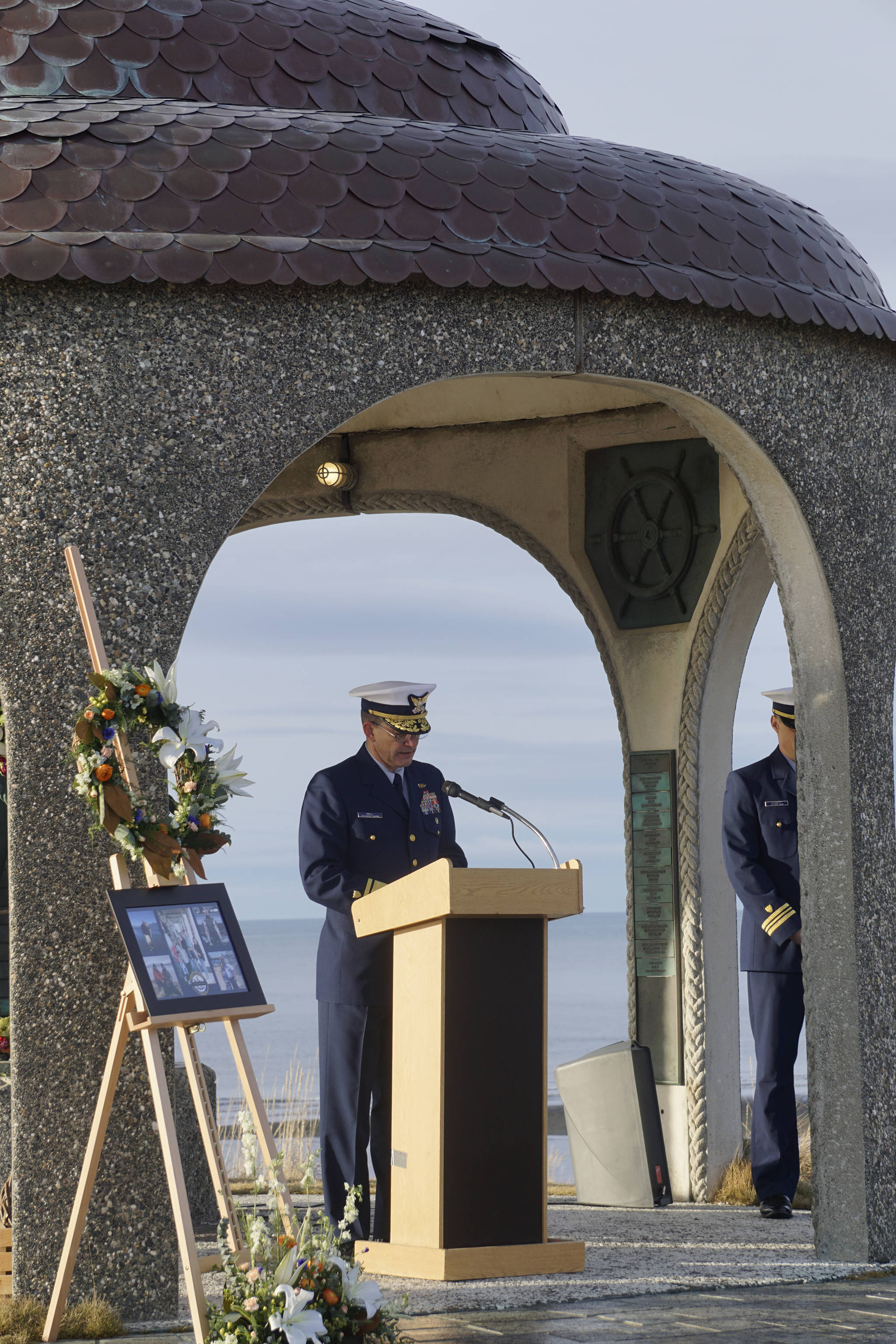 Adm. Matthew T. Bell Jr., 17th District Commander, U.S. Coast Guard, speaks at a memorial service for Chief Warrant Officer Michael Kozloski on Friday morning, Feb. 8, 2019, at the Seafarer’s Memorial on the Homer Spit, Homer, Alaska. (Photo by Michael Armstrong/Homer News)