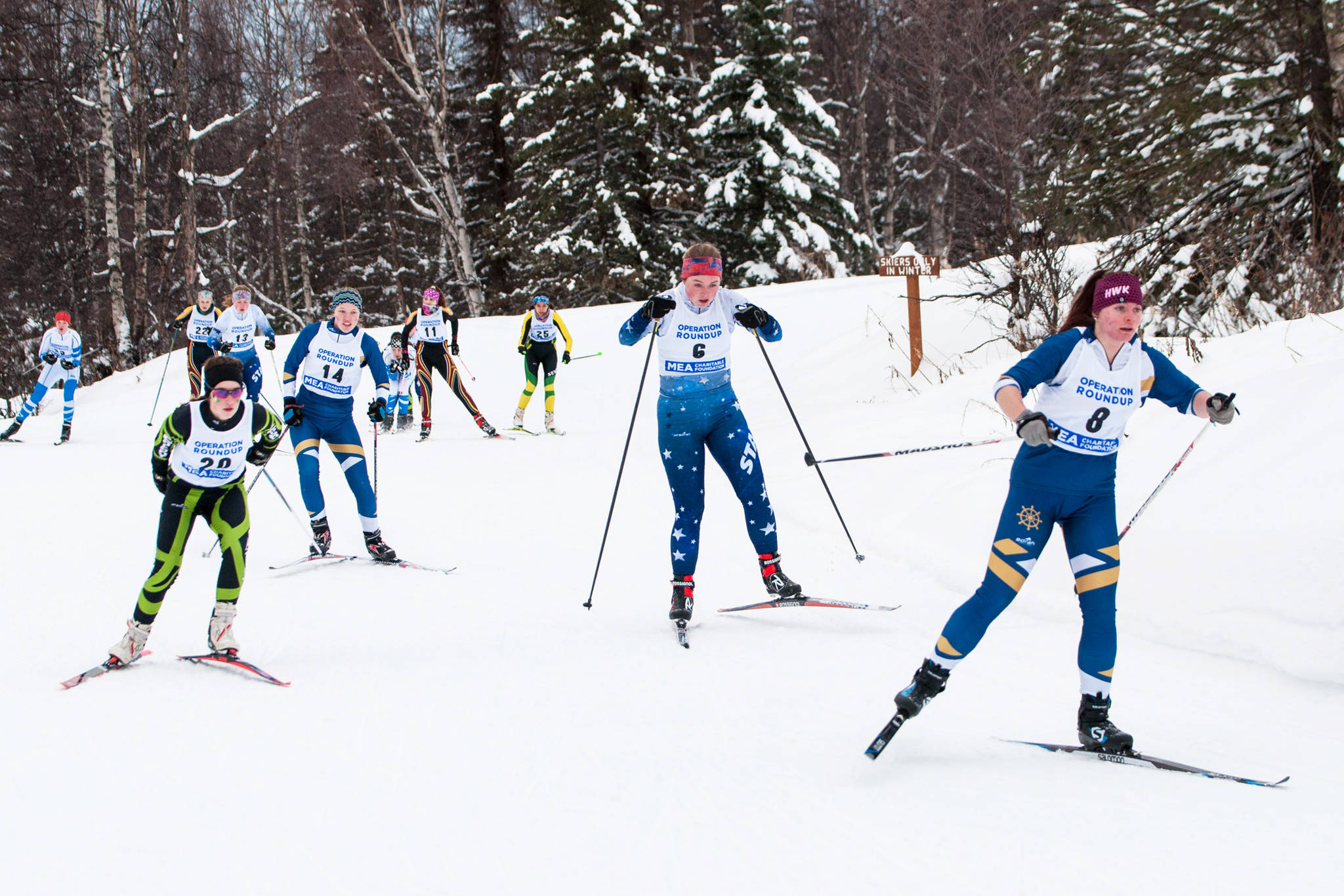 Katia Holmes (far right) and Zoe Stonorov (second from left) ski at the Region III meet held Friday and Saturday, Feb. 8-9, 2019 at the Government Peak Recreation Area near Palmer, Alaska. (Photo by Debbie Decker)