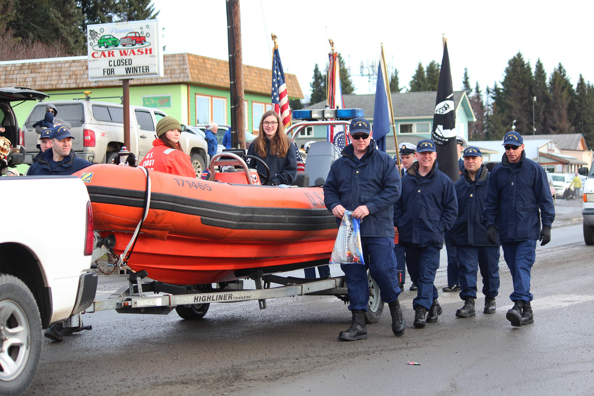 Members of the U.S. Coast Guard march down Pioneer Avenue as the Grand Marshals of this year’s Winter Carnival Parade on Saturday, Feb. 9, 2019 in Homer, Alaska. (Photo by Megan Pacer/Homer News)