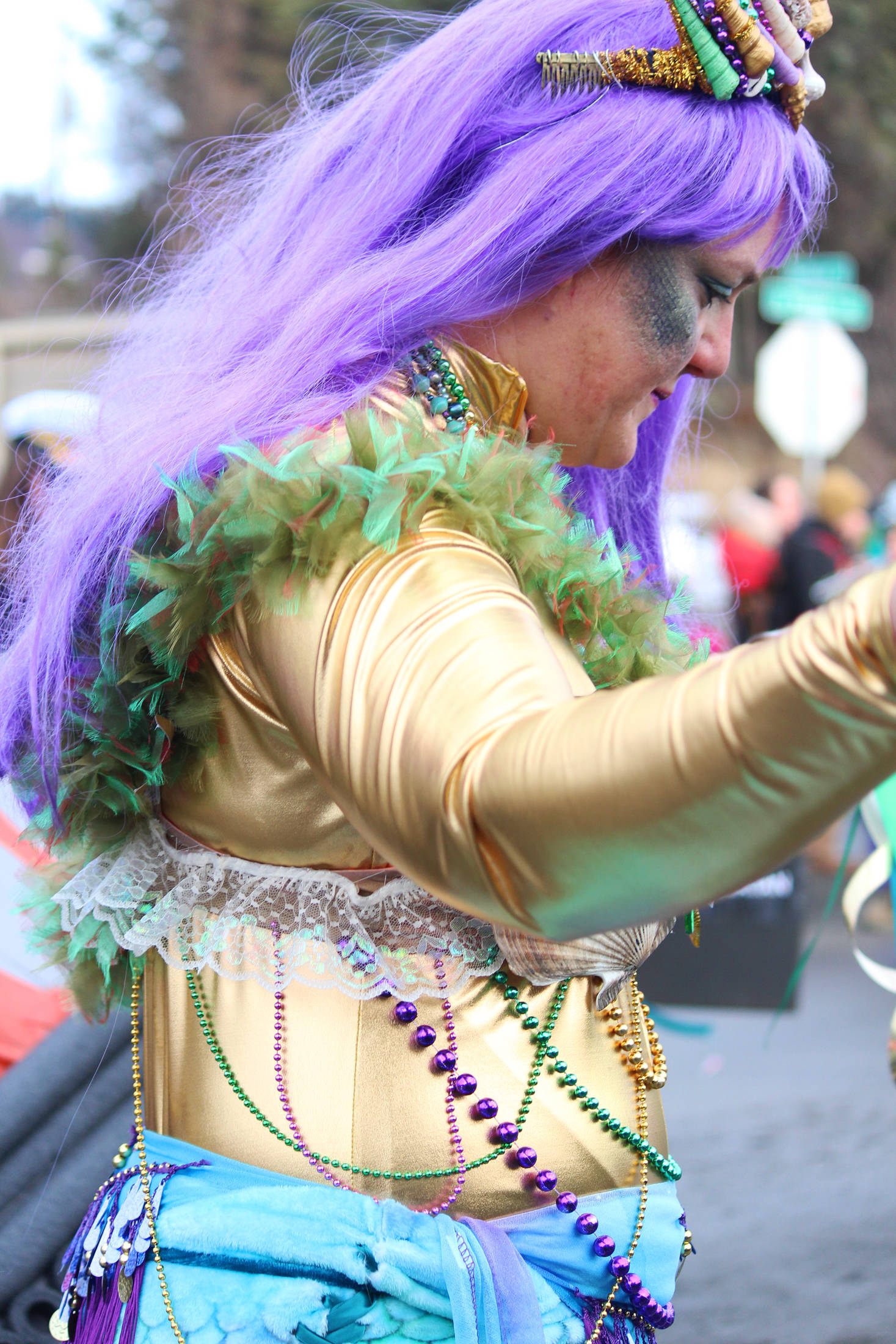 A woman dressed as a mermaid marches down Pioneer Avenue with the Krewe of Gambrinus on Saturday, Feb. 9, 2019 at the Winter Carnival Parade in Homer, Alaska. (Photo by Megan Pacer/Homer News)