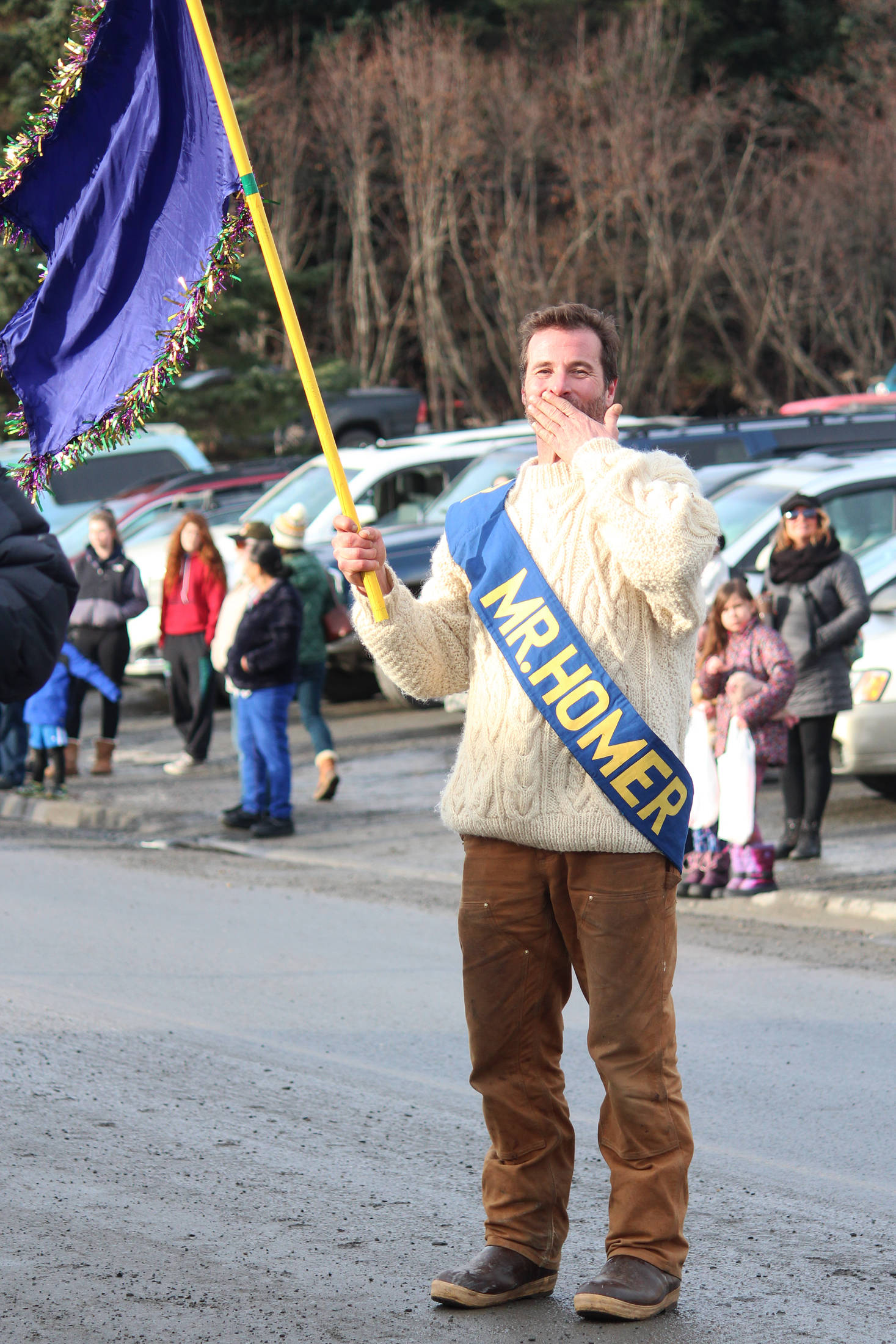 Anthony DiCosola, winner of the 2019 Mr. Homer Pageant, blows a kiss to the crowd Saturday, Feb. 9, 2019 at the Winter Carnival Parade in Homer, Alaska. (Photo by Megan Pacer/Homer News)