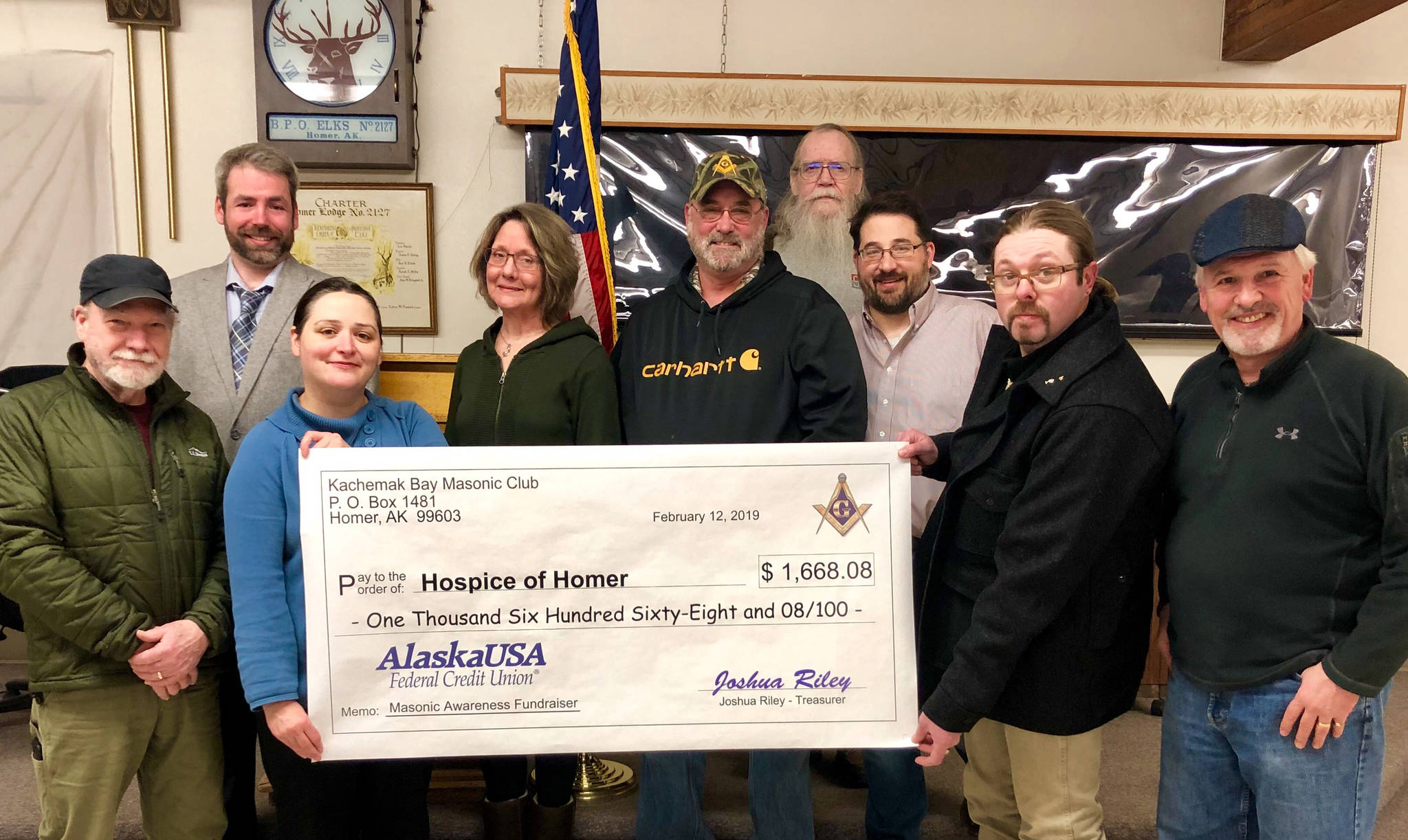 Members of the Kachemak Bay Masonic Club presented Hospice of Homer with a check for $1,668.08 on Feb. 12, 2019, at the Homer Elks Lodge in Homer, Alaska. From left to right are Michael Hawfield, Vern Miller, Jessica Golden, Beth Graber, Barry Haynes, Grady Svoboda, Erik Groves, Joshua Riley and Tom Stroozas. (Photo provided)