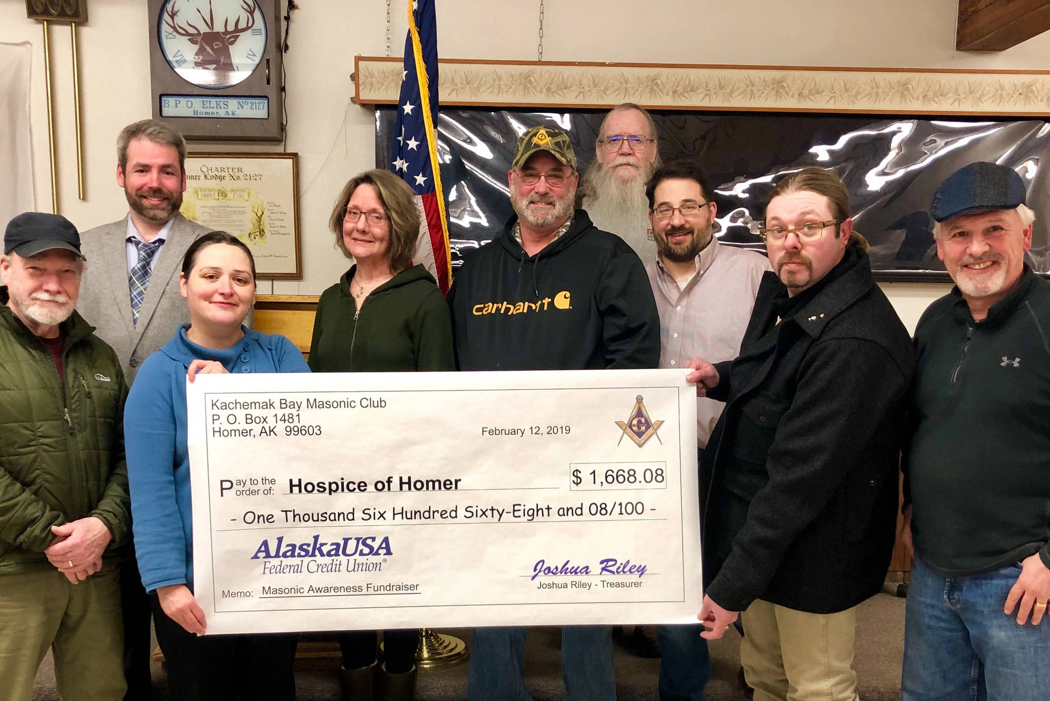 Members of the Kachemak Bay Masonic Club presented Hospice of Homer with a check for $1,668.08 on Feb. 12, 2019, at the Homer Elks Lodge in Homer, Alaska. From left to right are Michael Hawfield, Vern Miller, Jessica Golden, Beth Graber, Barry Haynes, Grady Svoboda, Erik Groves, Joshua Riley and Tom Stroozas. (Photo provided)