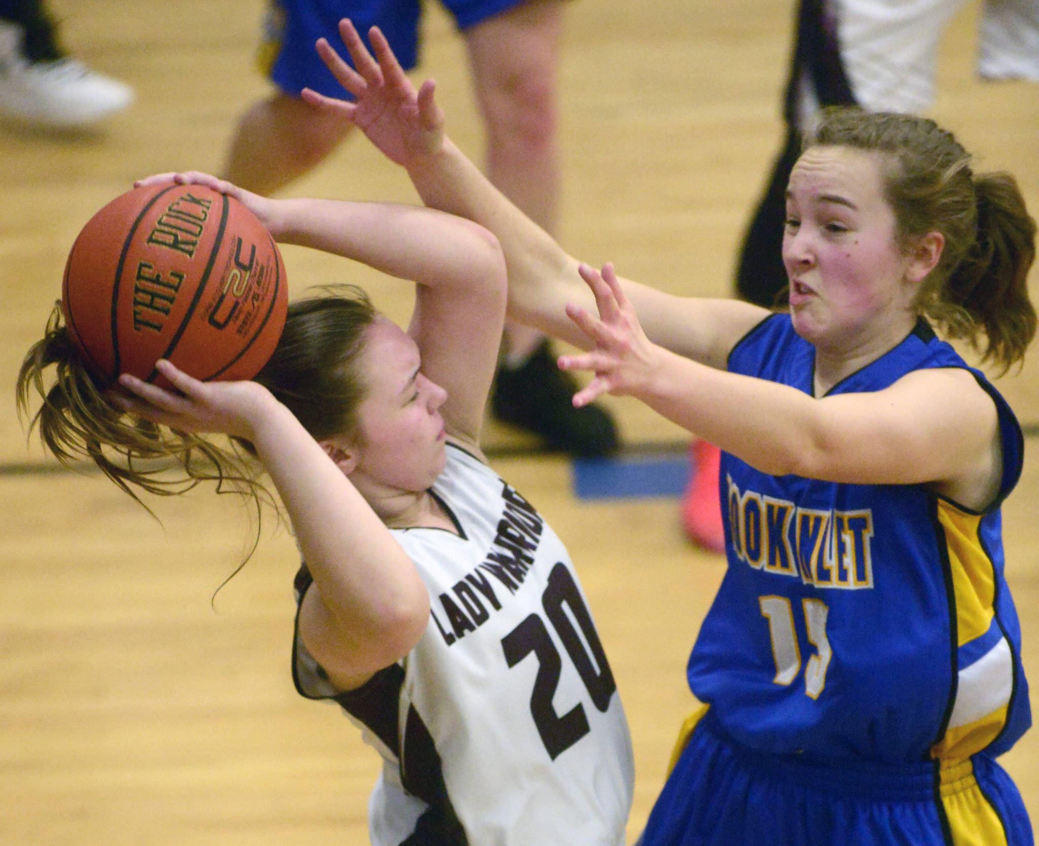 Cook Inlet Academy’s Addie Nelson pressures Nikolaevsk’s Krystyana Kalugin on Friday during the Peninsula Conference girls championship at Cook Inlet Academy in Soldotna. (Photo by Jeff Helminiak/Peninsula Clarion)