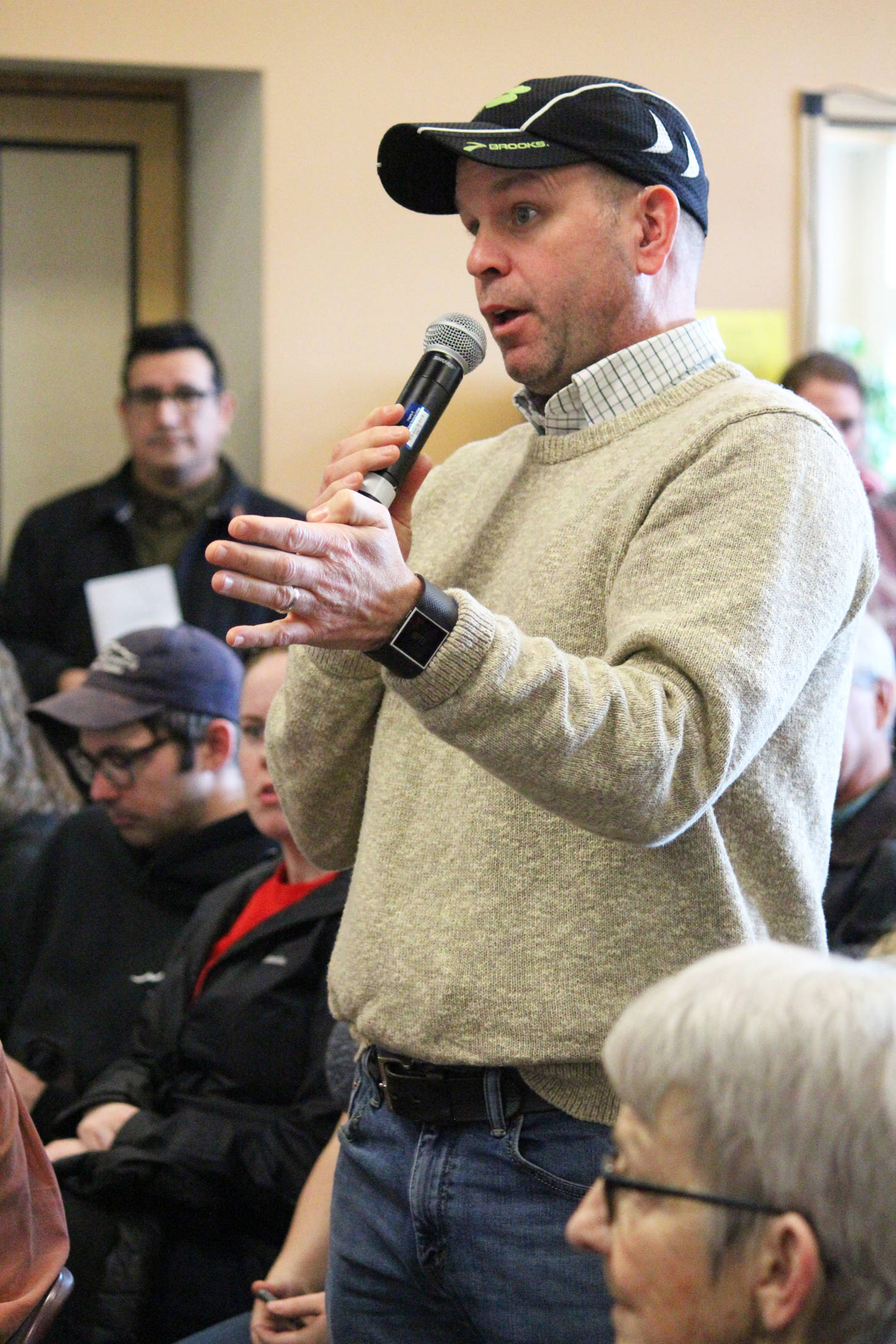Mike Illg, a member of the Kenai Peninsula Borough School District Board of Education, speaks to Rep. Sarah Vance (R-Homer) at a town hall meeting Saturday, March 2, 2019 at Kachemak Bay Campus in Homer, Alaska. Proposed cuts to public education funding were a major point of contention at the town hall. (Photo by Megan Pacer/Homer News)