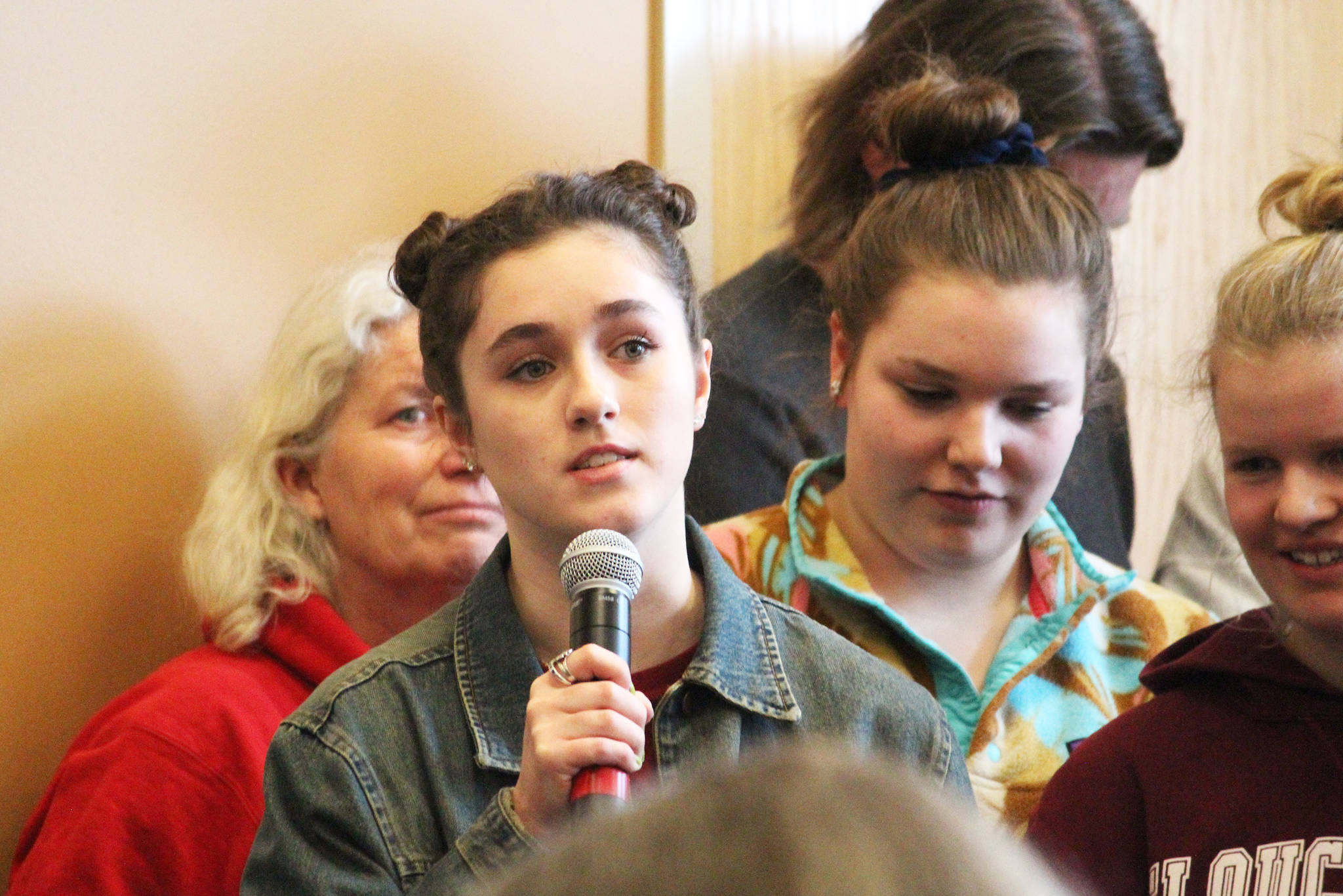 Sophie Morin, a junior at Homer High School, speaks to Rep. Sarah Vance (R-Homer) at a town hall meeting Saturday, March 2, 2019 at Kachemak Bay Campus in Homer, Alaska. Several students from the high school and the college spoke in defense of state funding for their educations. (Photo by Megan Pacer/Homer News)