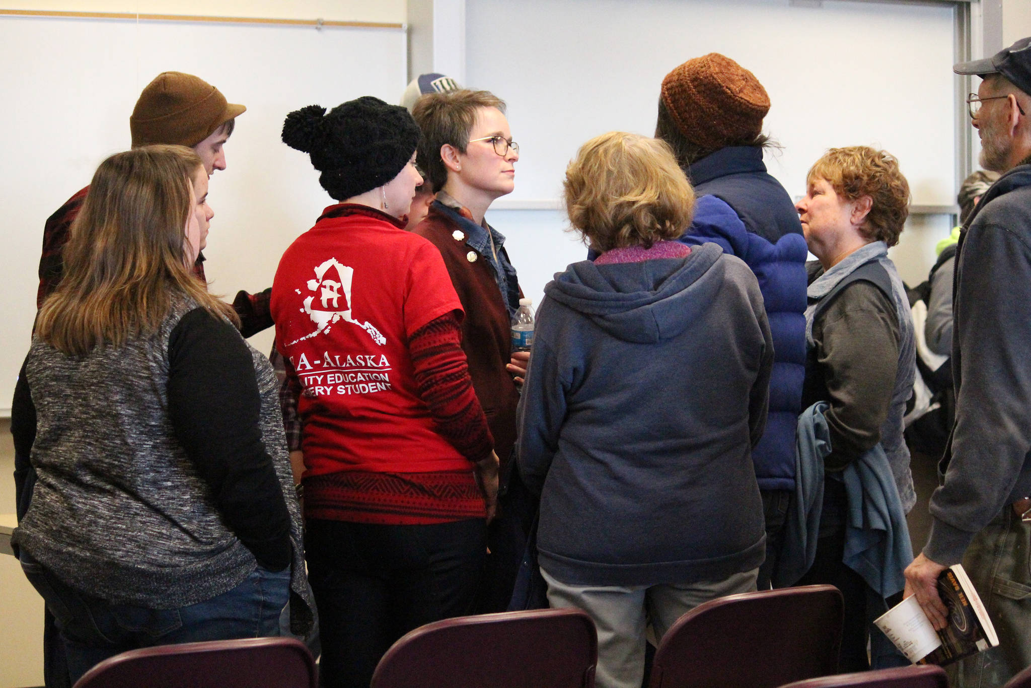 Rep. Sarah Vance (R-Homer) is surrounded by community members just after her town hall meeting Saturday, March 2, 2019 at Kachemak Bay Campus in Homer, Alaska. (Photo by Megan Pacer/Homer News)