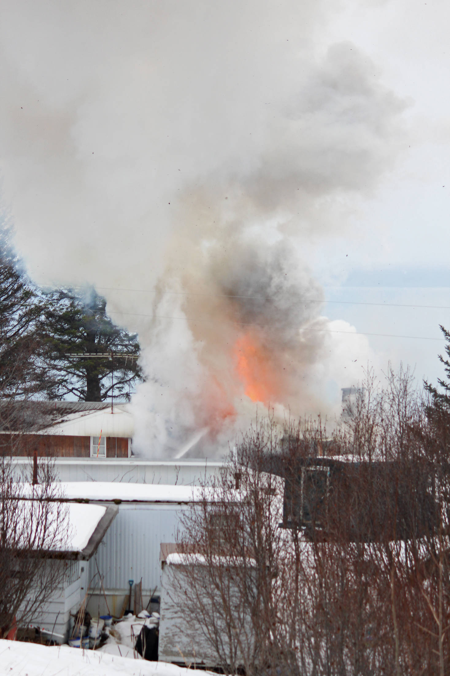 A fire at the old Bay View Inn near the Baycrest Overlook on the Sterling Highway sends a plume of smoke into the air Thursday, March 7, 2019 in Homer, Alaska. (Photo by Megan Pacer/Homer News)