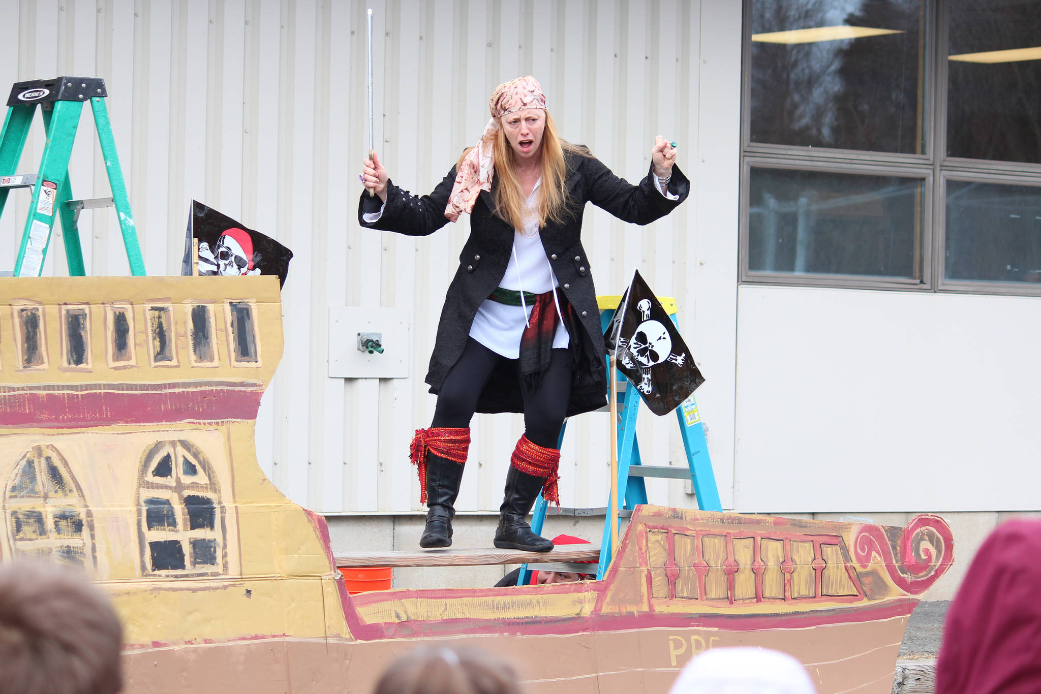 Robyn Walls prepares to “walk the plank” of a makeshift pirate ship during a Thursday, March 7, 2019 celebration of the read-a-thon Paul Banks Elementary students did, at the school in Homer, Alaska. Students read roughly 196,000 minutes, surpassing their goal. (Photo by Megan Pacer/Homer News)