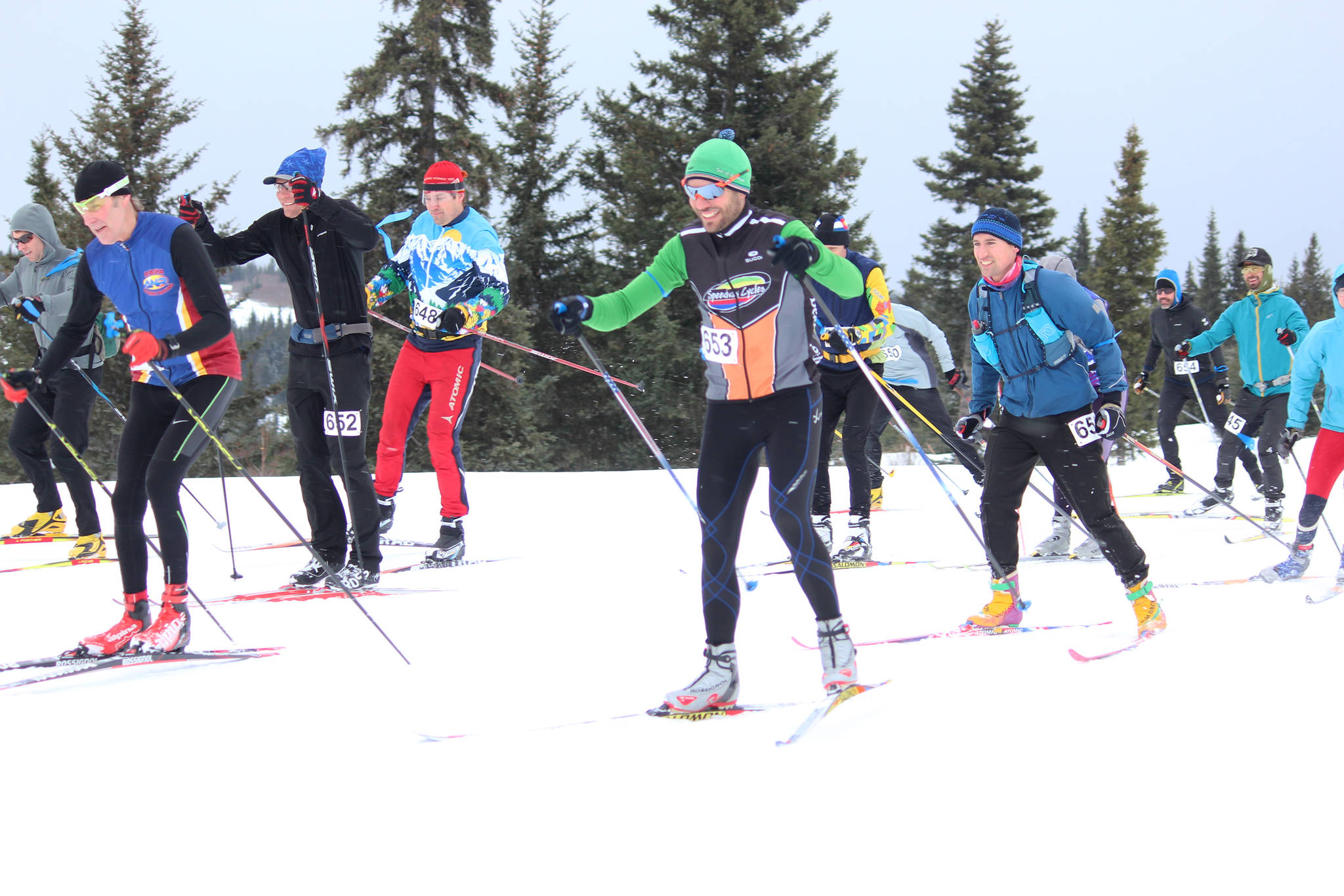 Participants in the 42 kilometer portion of the Kachemak Nordic Ski Marathon take off from the starting line Saturday, March 9, 2019 at the Lookout Mountain Trails near Homer, Alaska. The 42k race actually had to be shortened to 38k when a portion of the trail was lost in the bad weather. (Photo by Megan Pacer/Homer News)