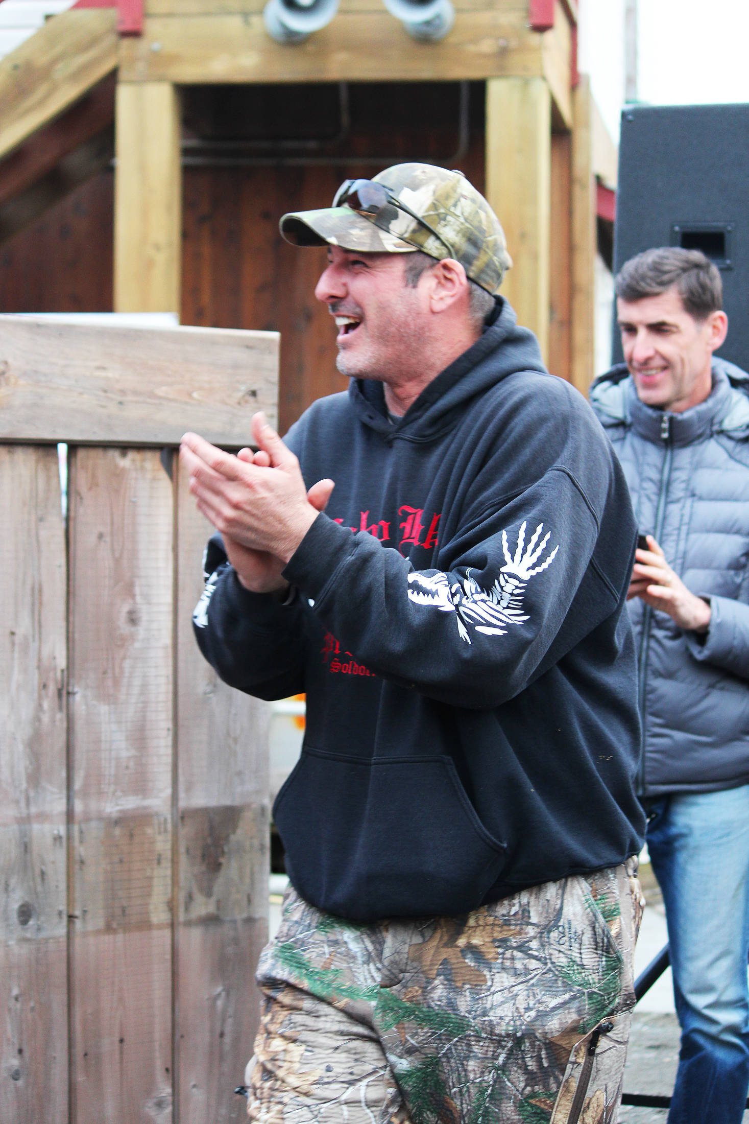 Chad Webb accepts his second place award for his 25.44-pound king salmon Saturday, March 23, 2019 at the Homer Winter King Salmon Tournament in Homer, Alaska. (Photo by Megan Pacer/Homer News)