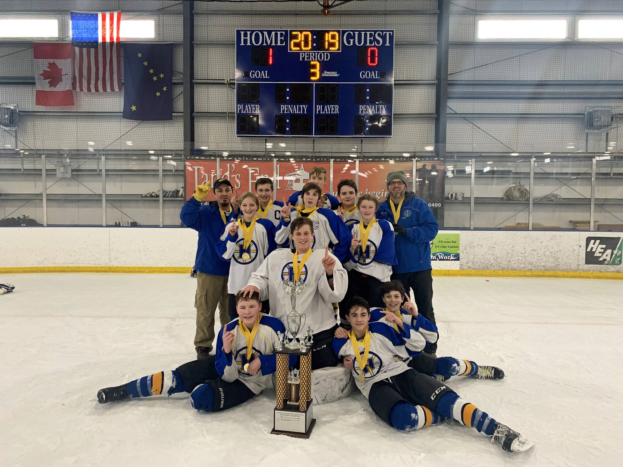 Homer’s youth hockey team for those 14 and under celebrate their win at the Alaska State Championships the weekend of March 15-18, 2019 at the Kevin Bell Ice Arena in Homer, Alaska. (Photo by Jennifer Nevak)