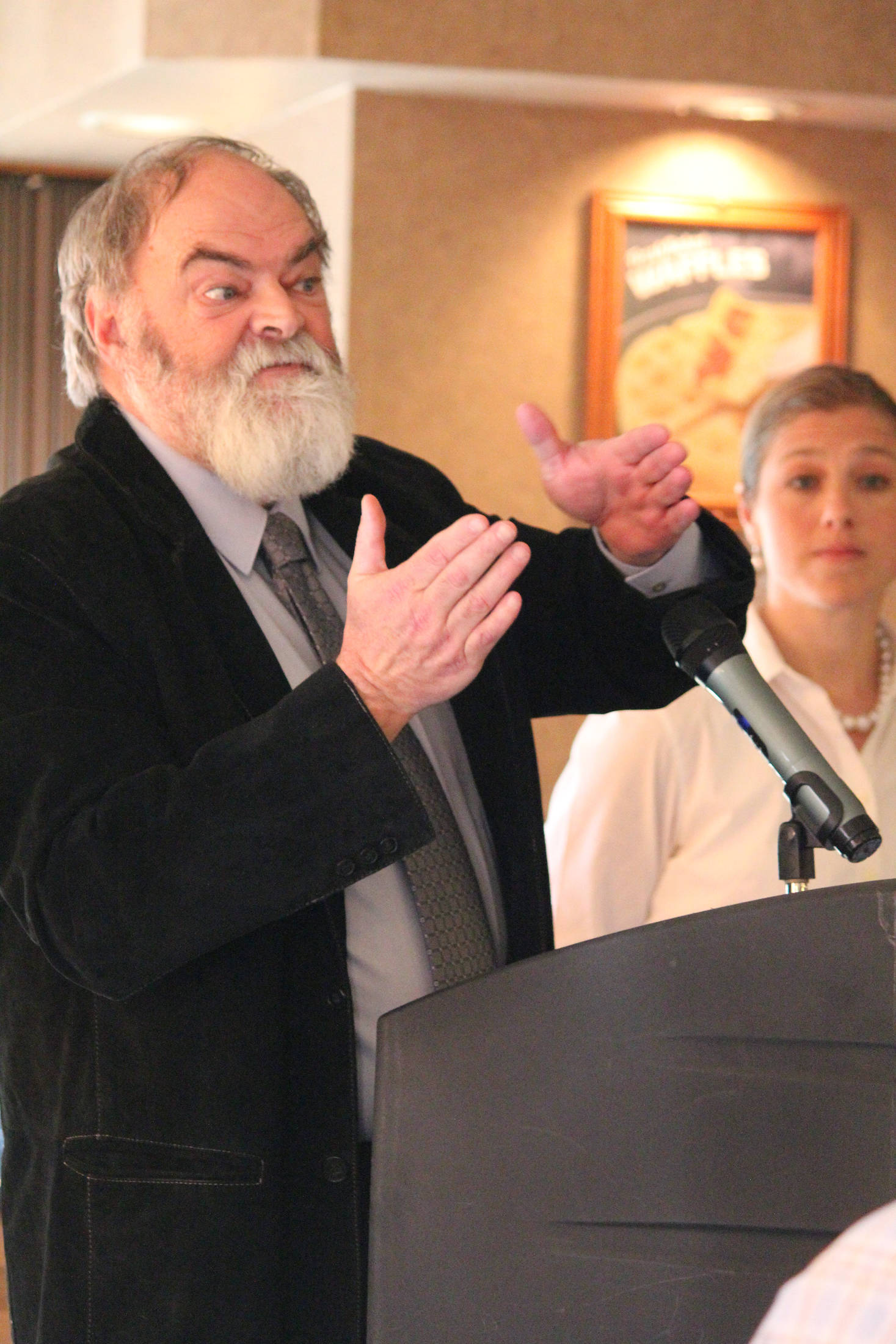 Mayor Ken Castner addresses a crowd of people at a Tuesday, March 26, 2019 Homer Chamber of Commerce meeting during a “State of the City” address at the Best Western Bidarka Inn in Homer, Alaska. (Photo by Megan Pacer/Homer News)
