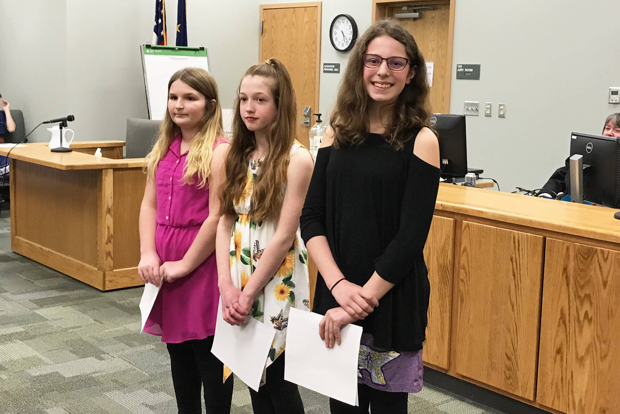 Left to right: Kaiah Stineff, Claira Booz and Rainey Sundheim receive an award during a Youth Court program induction ceremony on March 27, 2019 at the Homer Courthouse in Homer, Alaska. They all got a perfect score on the bar exam they had to take through the program. (Photo courtesy Becky Paul)