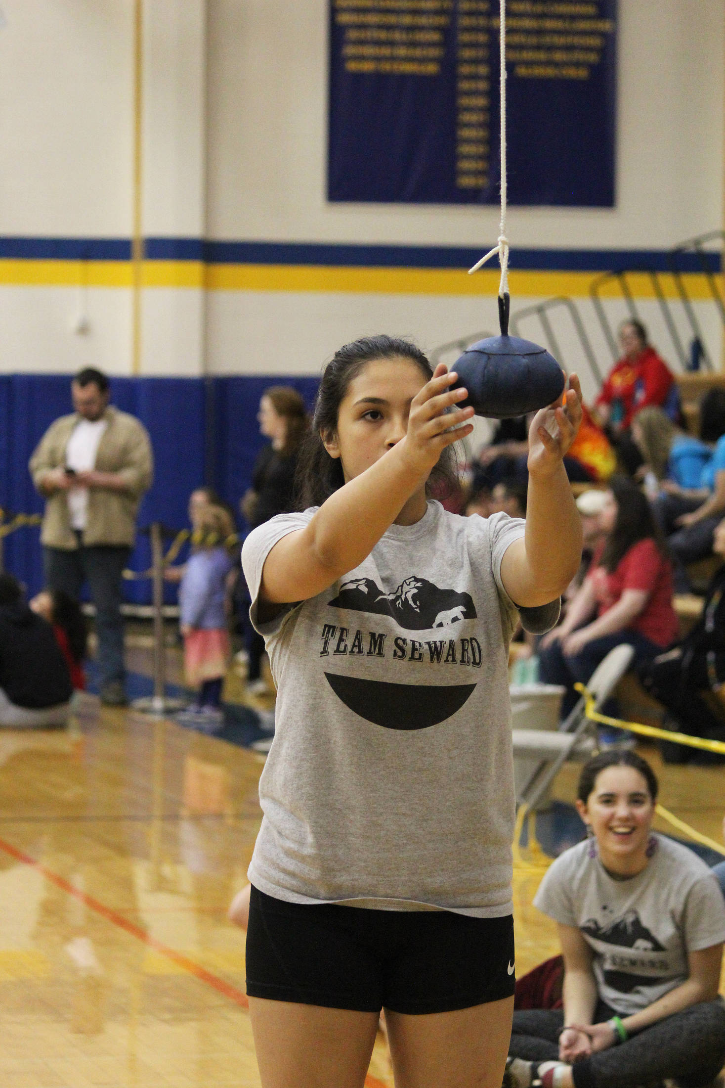 Chloe Lastimosa, 13, steadies her target before participating in the one-foot high kick Saturday, March 30, 2019 at the Kachemak Bay Traditional Games at Homer High School in Homer, Alaska. (Photo by Megan Pacer/Homer News)