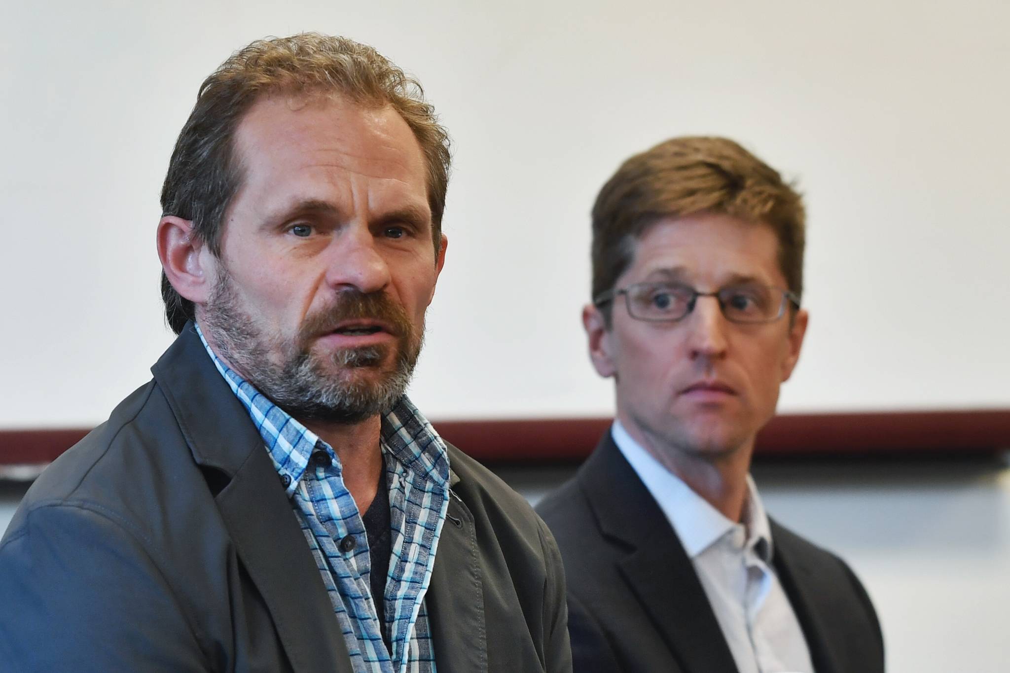 Dr. Daniel Schindler, a professor in the School of Aquatic and Fishery Sciences at the University of Washington, left, and Dr. Cameron Wobus, a Senior Scientist at Lynker Technologies, present at a press conference against thePebble Mine project on Monday, April 1, 2019. (Michael Penn | Juneau Empire)
