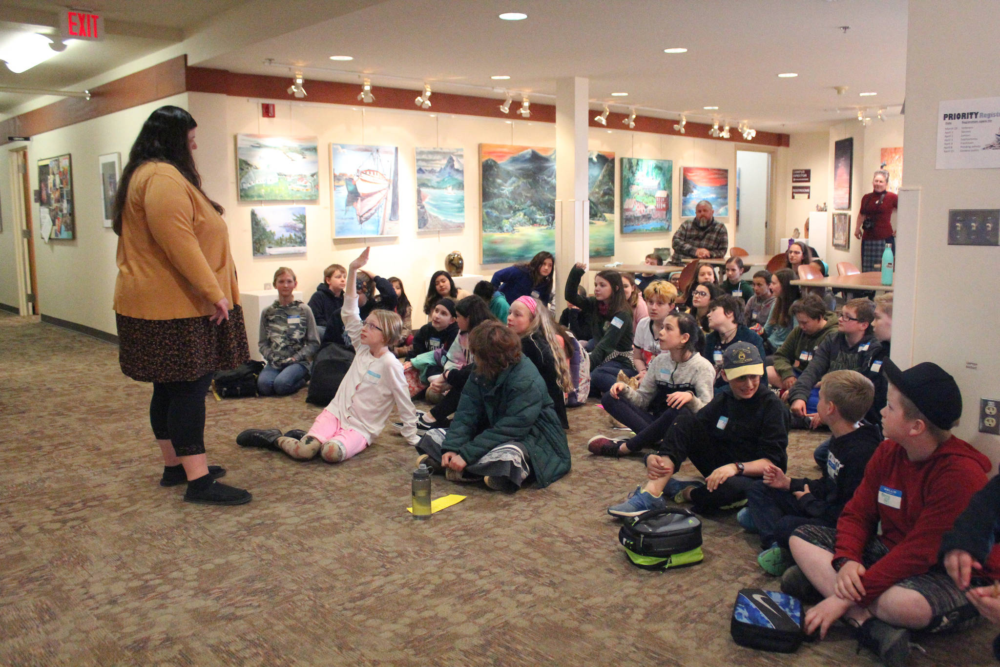 Nancy Johnson, student services counselor at Kachemak Bay Campus, talks to a group of sixth grade students at on a visit from West Homer Elementary School through the Kids2College program Friday, April 5, 2019 at the college campus in Homer, Alaska. (Photo by Megan Pacer/Homer News)