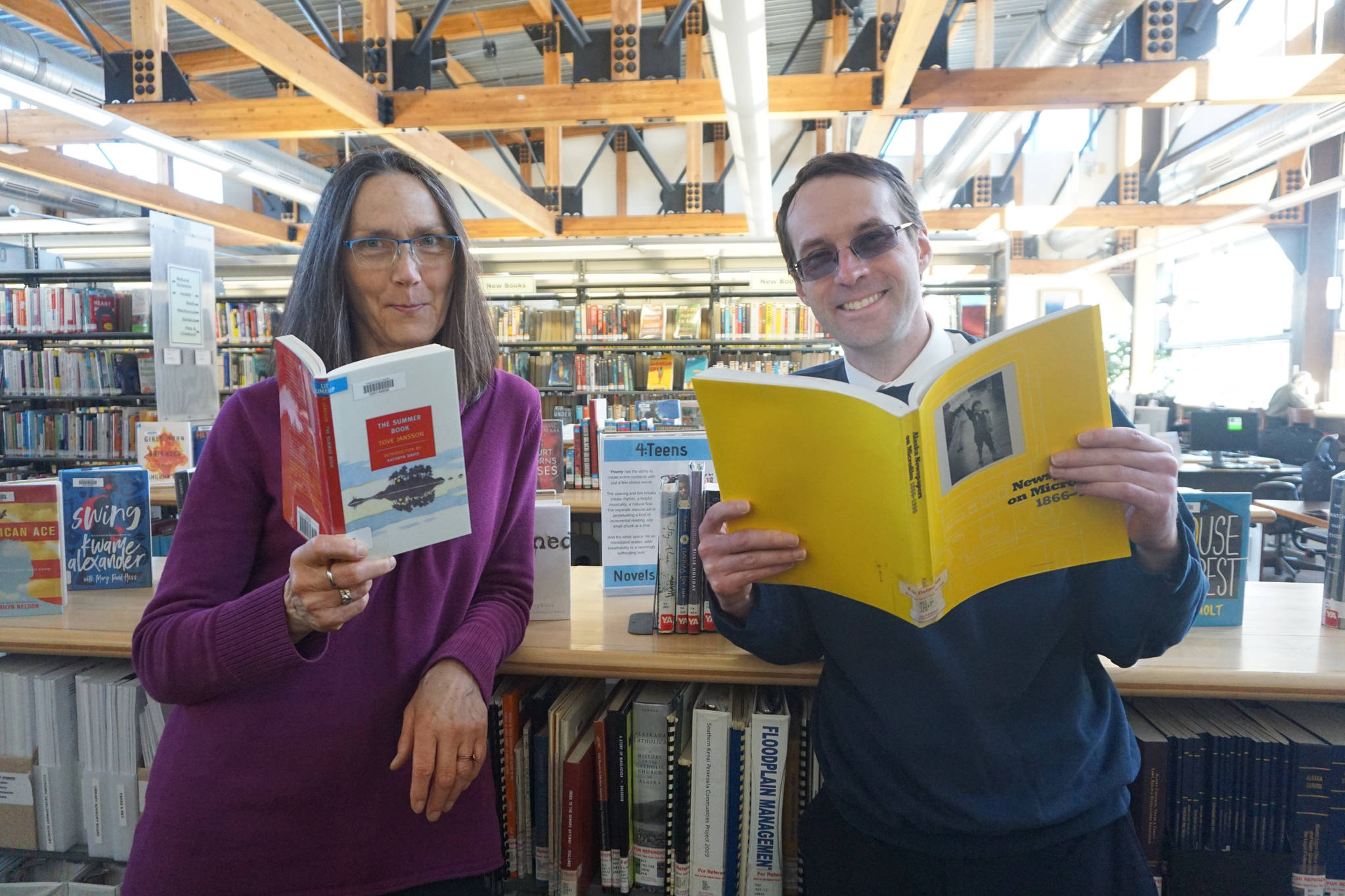 Homer Public Library Director Ann Dixon, left, poses for a photo with incoming Library Director David Berry, right, on April 15, 2019, at the library in Homer, Alaska. (Photo provided)