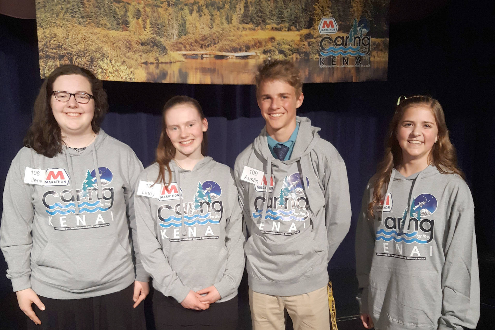 From left, the Caring for the Kenai finalists Akilena Veach and Lindy Guernsey (second place), Austin Cline (first place), and Anna DeVolld (third place) pose for a photo at Kenai Central High School in Alaska on Thursday, April 18, 2019. (Photo by Brian Mazurek/Peninsula Clarion)