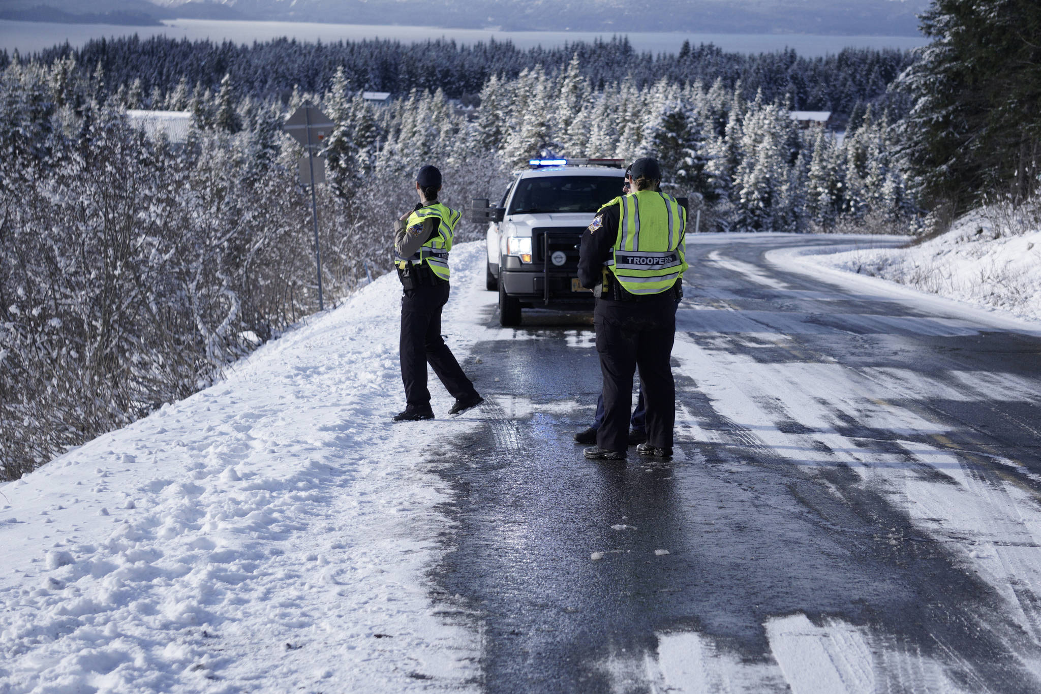 Alaska State Troopers respond to a vehicle that went over the edge of Diamond Ridge Road on Monday morning, April 22, 2019, in Homer, Alaska. A sport utility vehicle failed to make a turn heading south and went down the side of a stretch of road known by locals as Beck’s Hill. No one was injured in the crash. (Photo by Michael Armstrong/Homer News)