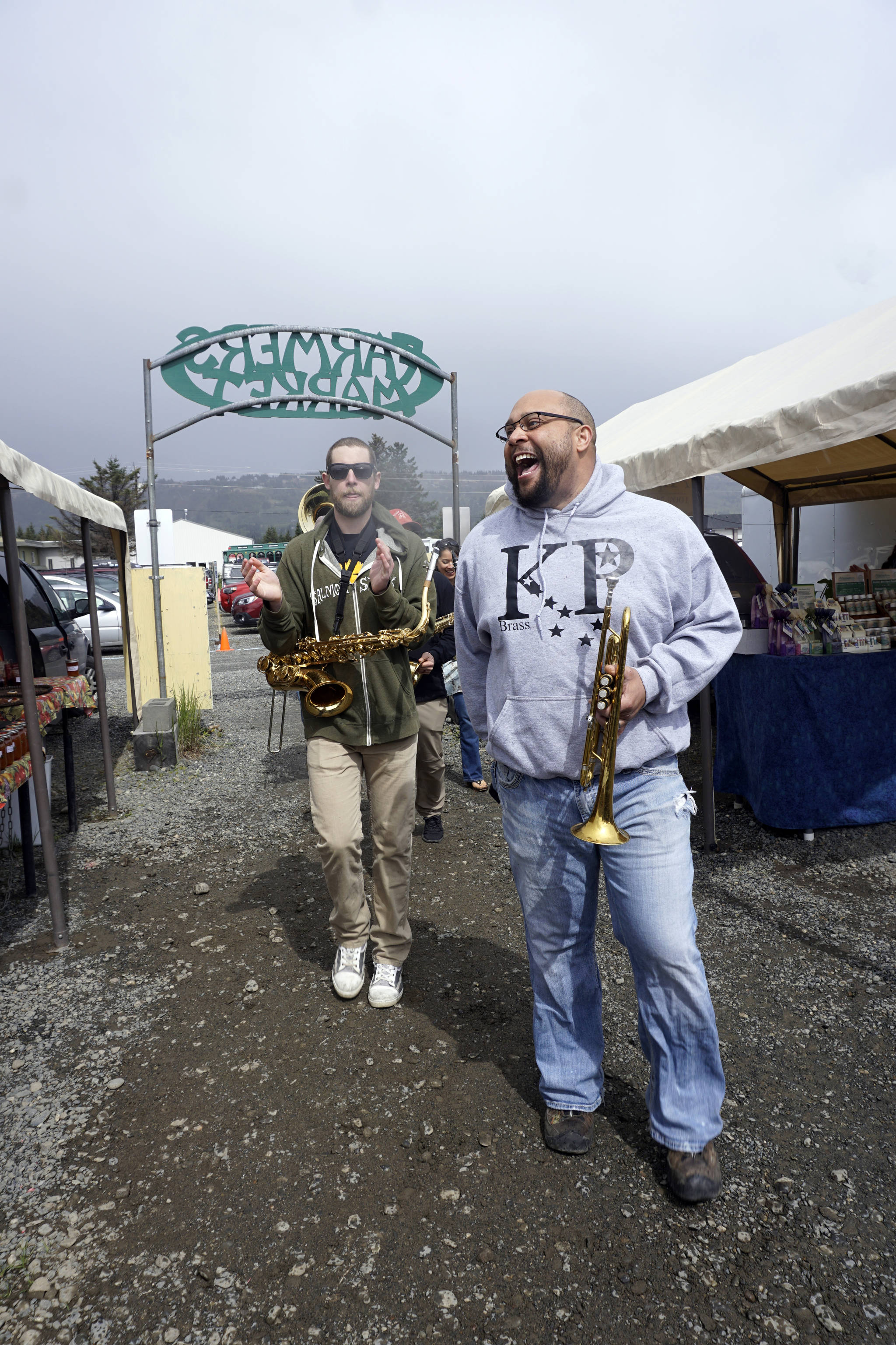Nelton Palma marches with the KP Brass Band at the Homer Farmers Market for opening day on May 26, 2018. (Photo by Michael Armstrong/Homer News)