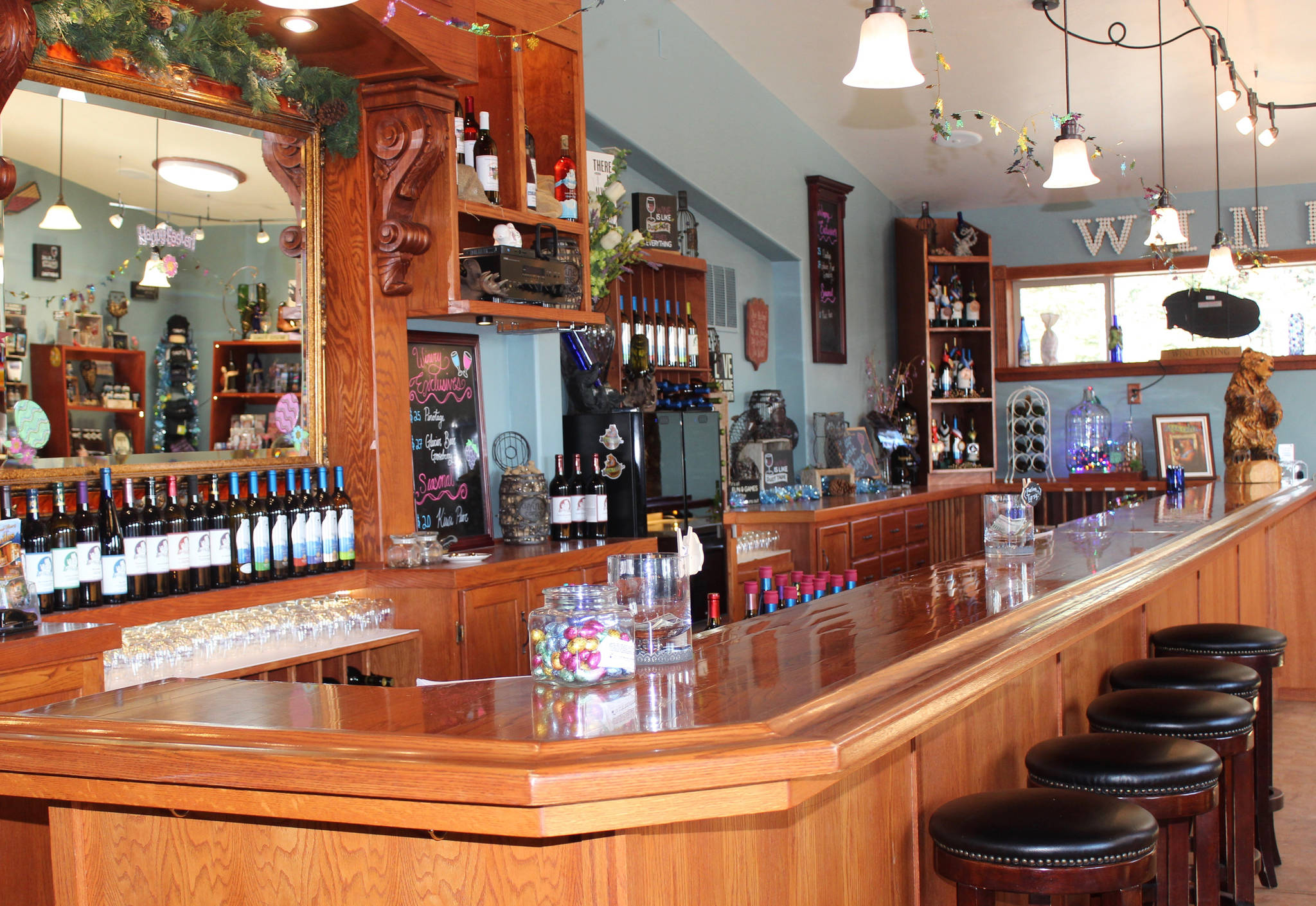Bear Creek Winery’s tasting room offers both of the winery’s brands, as seen here in this photo taken April 17, 2019. The original Bear Creek brand has nine wines on the tasting list year-round and five seasonal wines. Five different wines are under the Glacier Bear brand, made strictly from Alaskan-grown berries and fruits at its location in Kachemak City, Alaska. (Photo by McKibben Jackinsky)