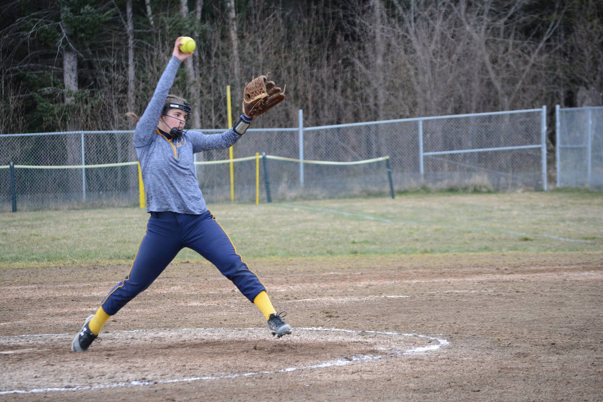 Homer High School Mariners softball pitcher Annalynn Brown winds up for a throw on Tuesday, April 30, 2019, against Soldotna High School at Jack Gist Park in Homer, Alaska. (Photo by Michael Armstrong/Homer News)