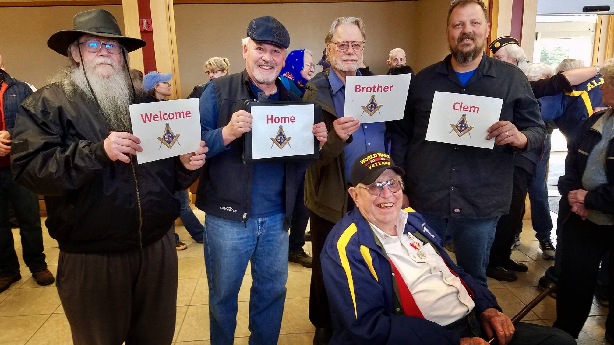 Members of the Homer Masonic Lodge turned out last Saturday, May 4, 2019, to honor World War II veteran Clem Tillion after his return on a Last Frontier Honor Flight. They also showed appreciation for his many years of Masonic service. In the photo standing behnd Tillion are, left to right, are Grady Svoboda, Tom Stroozas, Dave Spell and Greg Martin. Tillion took part in the Last Frontier Honor Flight, a trip that takes Alaska veterans to Washington, D.C. to see the sites and take in the memorials built in their honor . “It’s nice that they remember,” said Clem Tillion, a World War II veteran and former state lawmaker. Tillion remembers the war as well as anyone. As part of the Marine Corps in World War II, his journey took him to the Pacific Theater in Samoa, Guadalcanal, and elsewhere looking for unexploded ordnances. “Freedoms are won by somebody that goes out and fights for it. You don’t have anything without it,” said Tillion. “I don’t think I’m anything spectacular. I just went in, did it, and came out alive.” Tillion made the trip with mostly Korea and Vietnam veterans, 23 total on the flight. He was one of four World War II veterans on the trip. (Photo provided)