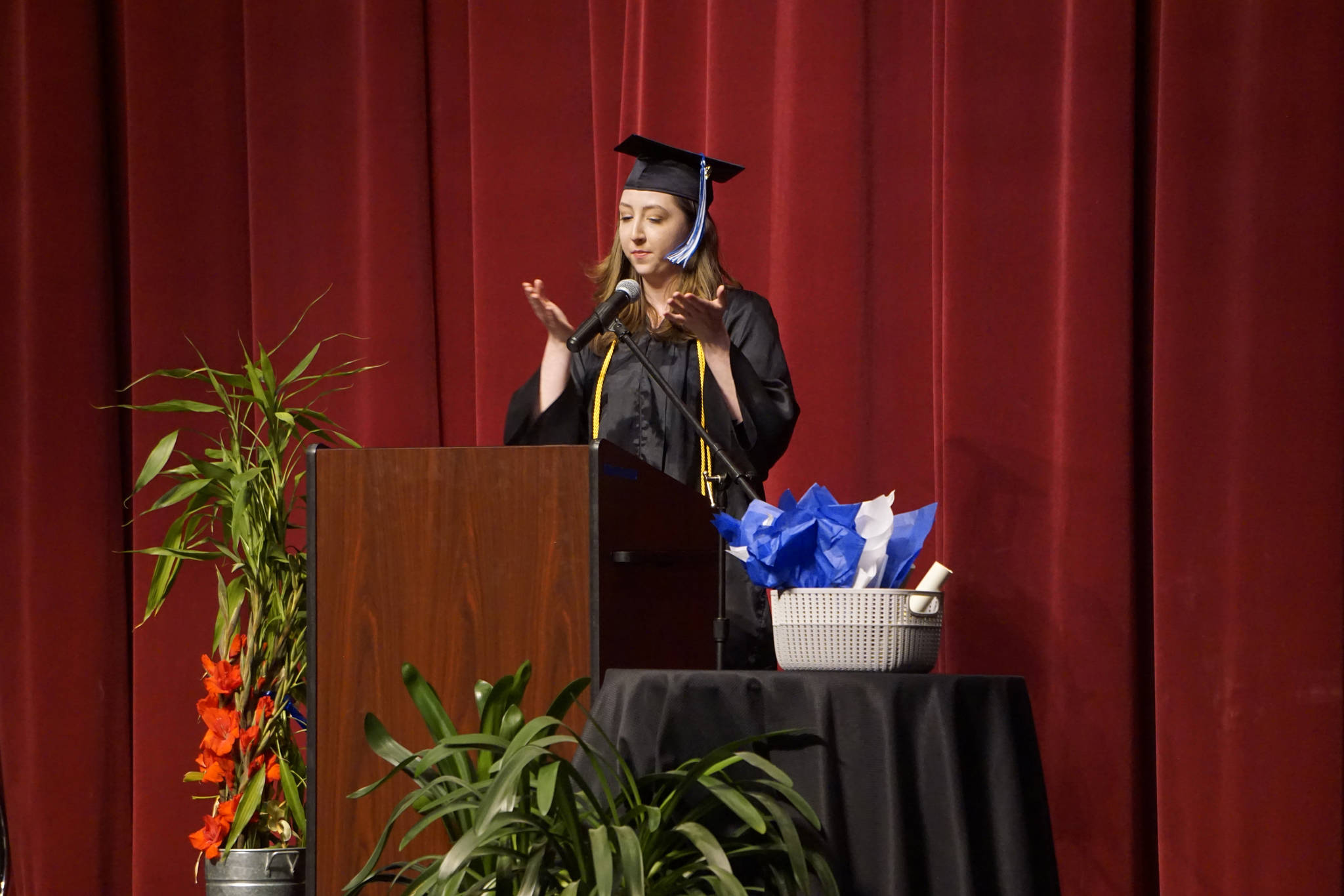 Valedictorian Abgail Ensign speaks at the Kachemak Bay Campus commencement last Wednesday, May 8, 2019, at the Mariner Theatre in Homer, Alaska. Ensign received an associate of arts degree from KBC. (Photo by Michael Armstrong/Homer News.)