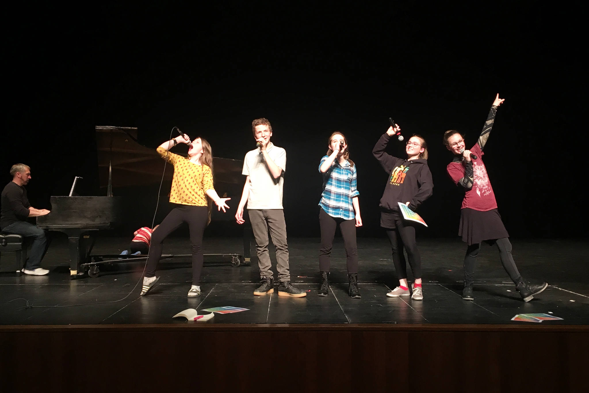 Performers in “Kaleidoscope” rehearse on May 5, 2019, at the Mariner Theatre in Homer, Alaska. (Photo by Tia Pietsch)