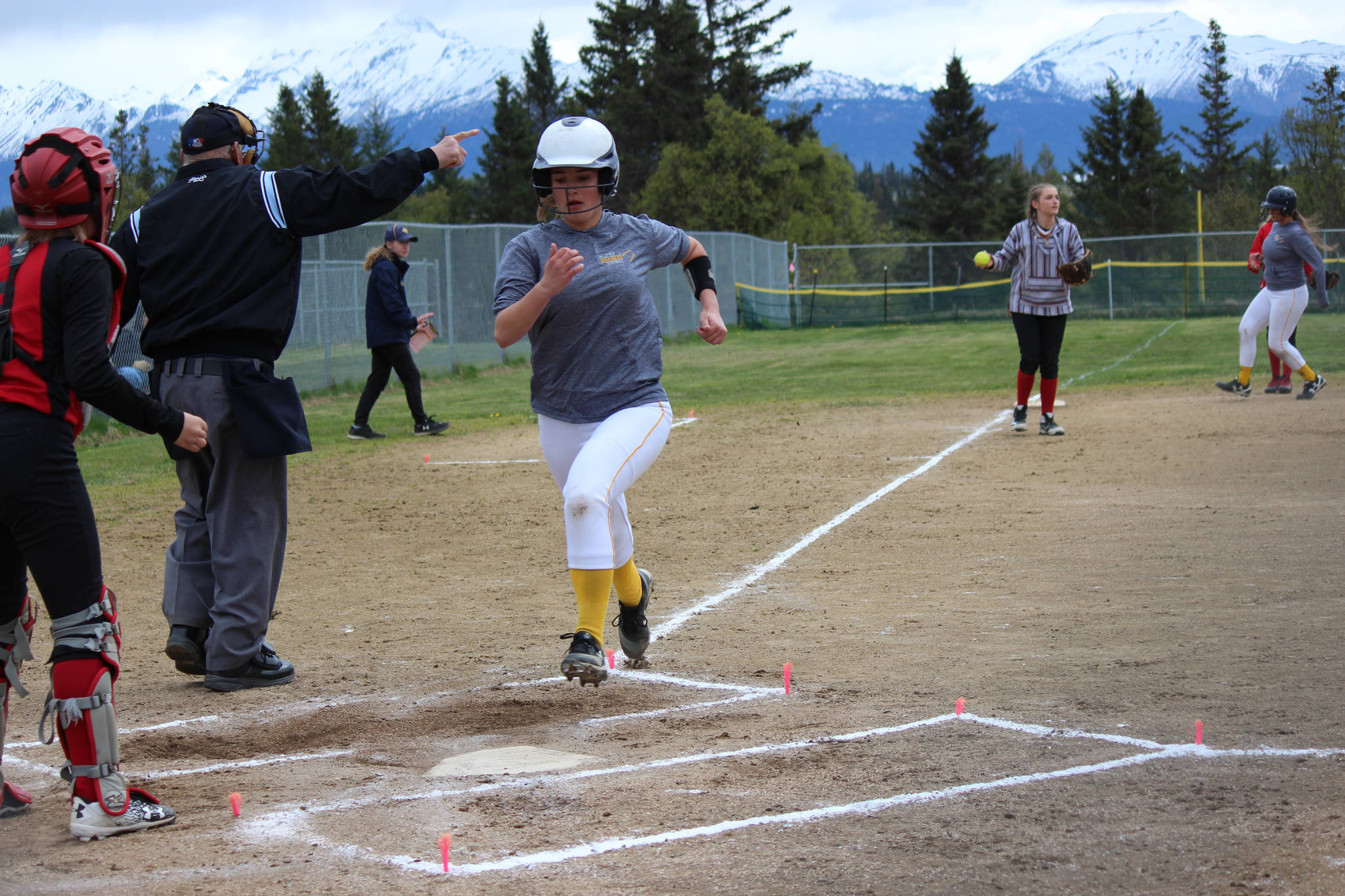 Mariner Annalynn Brown scores a run for the Mariners in the first inning of Saturday’s game against the Kenai Central Kardinals.