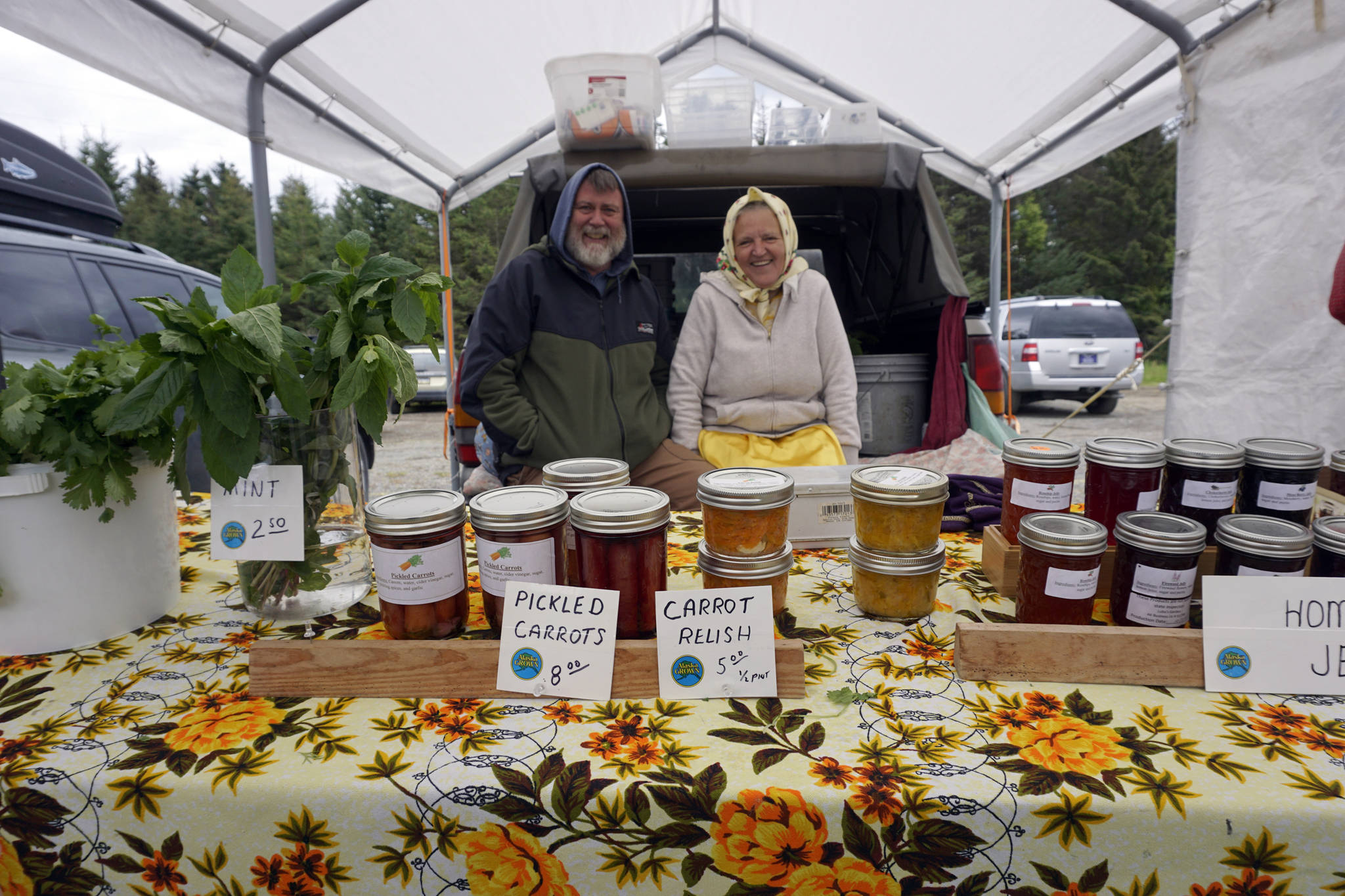 Dan and Luba Dorvall of Nikolaevsk start another season at the opening of the Homer Farmers Market on Saturday, May 25, 2019, in Homer, Alaska. (Photo by Michael Armstrong/Homer News)