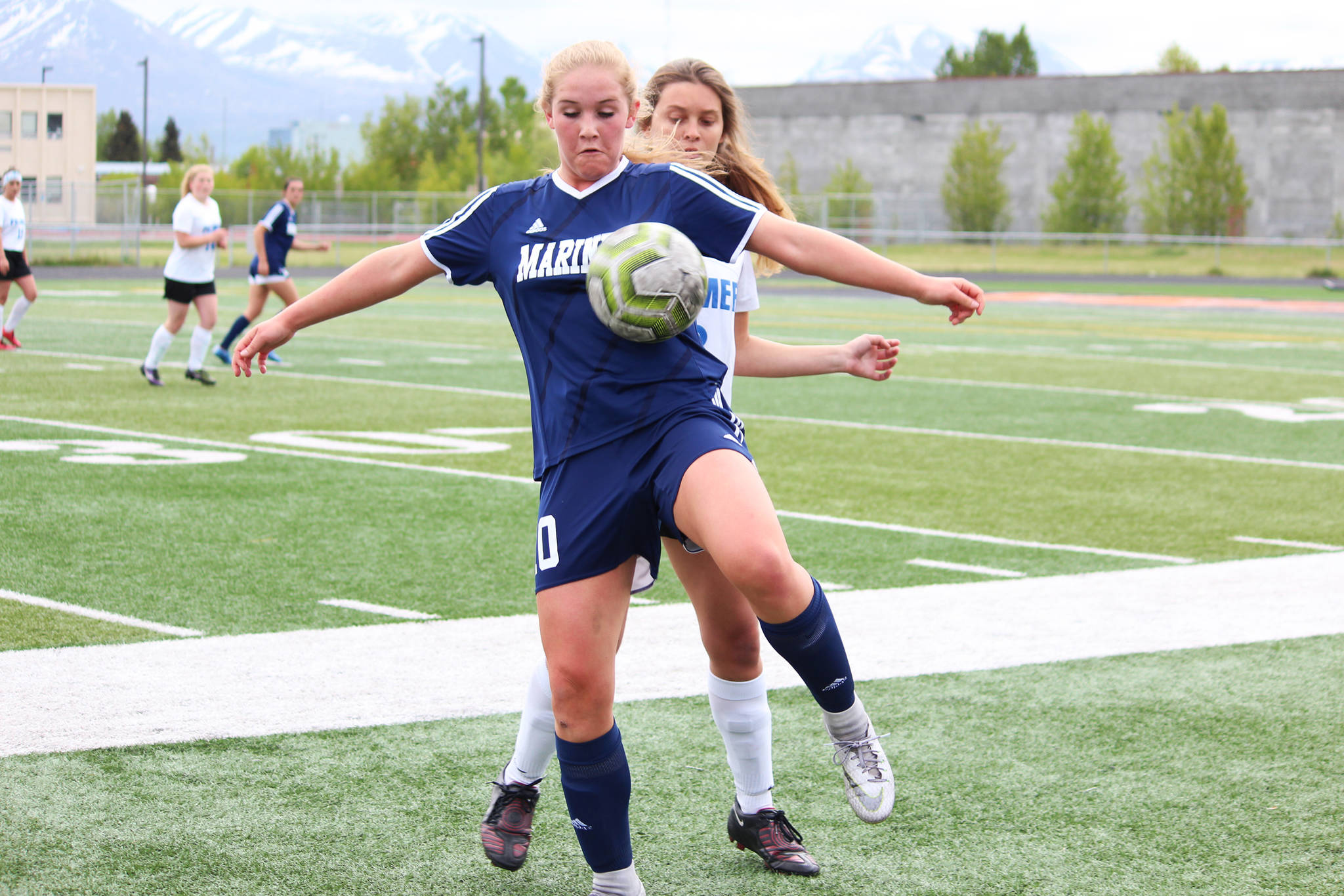 Homer’s Paige Jones sneaks in front of Palmer’s Natalia Bonadio to get the ball on the throw in during a Friday, May 24, 2019 game in the Division II state soccer championship tournament at West Anchorage High School in Anchorage, Alaska. (Photo by Megan Pacer/Homer News)