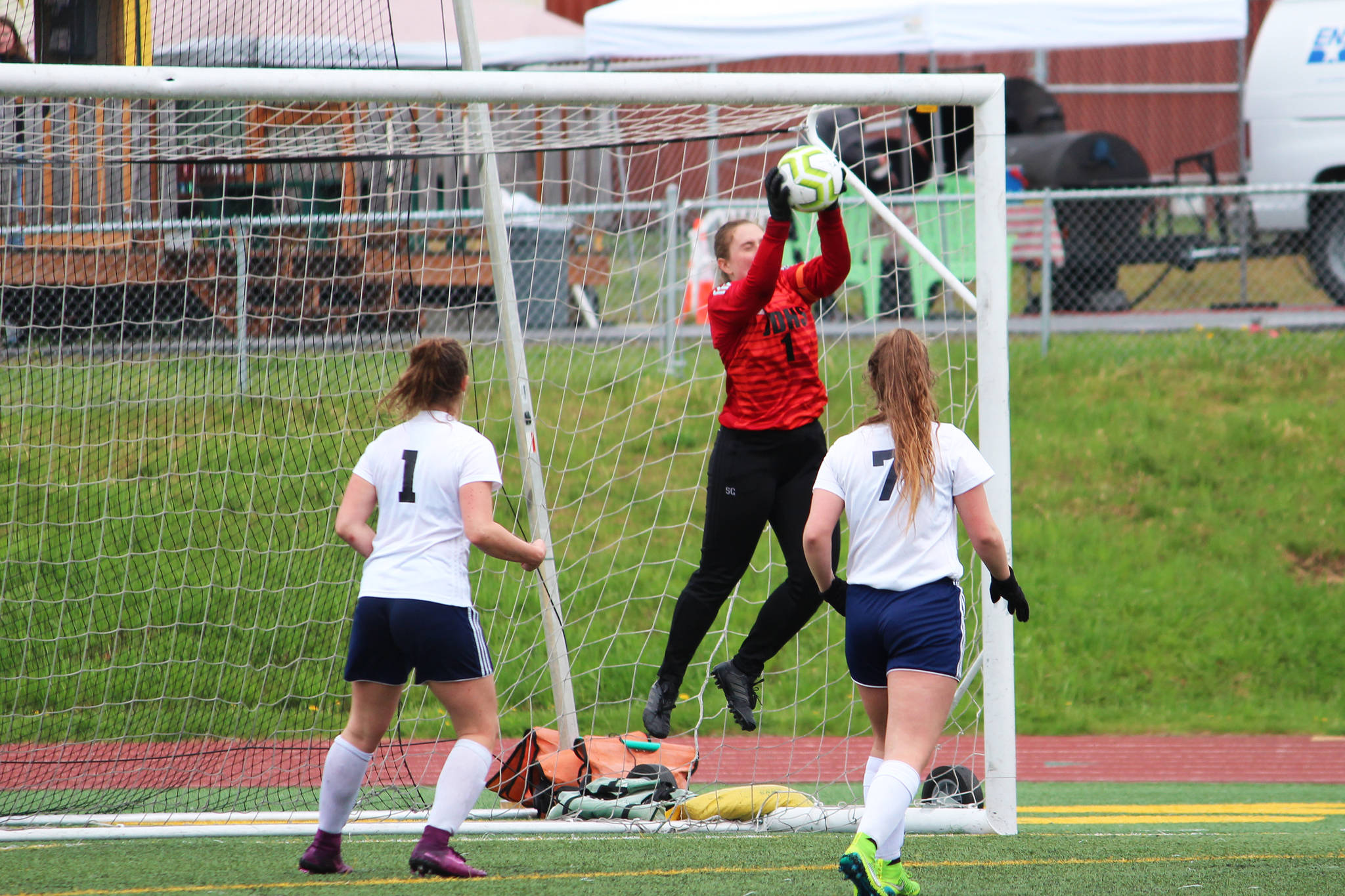 Juneau goalkeeper Shaylin Cesar grabs a ball out of the air on a shot from Soldotna’s team during the final game of the Division II state soccer championships Saturday, May 25, 2019 at Service High School in Anchorage, Alaska. (Photo by Megan Pacer/Homer News)
