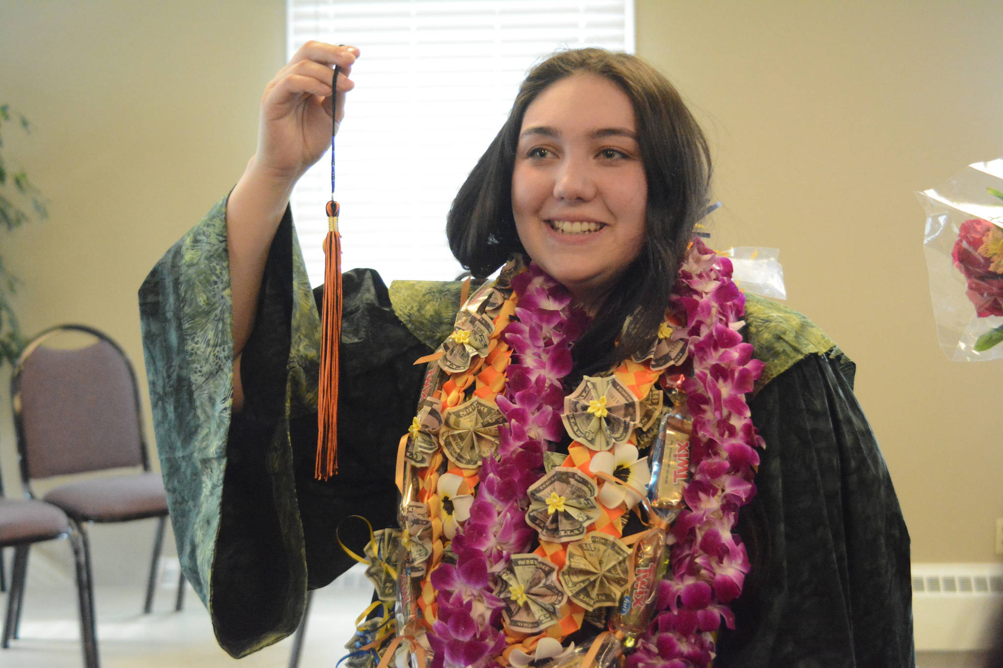 Hailee Fisher poses for a photo after graduation ceremonies on Wednesday, May 22, 2019, at Land’s End Resort in Homer, Alaska. Fisher made her own robe with help from Flex counselor Ingrid Harrald. (Photo by Michael Armstrong/Homer News)