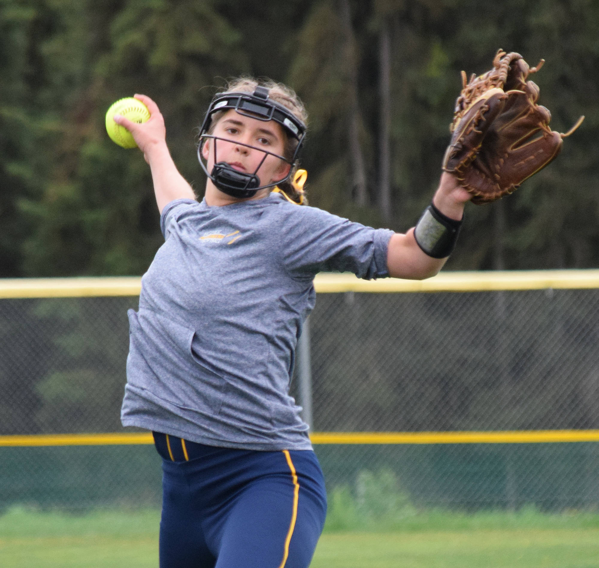 Homer’s Annalynn Brown winds up for a pitch to a Ketchikan batter at the Division II state softball tournament Saturday, June 1, 2019, at Cartee Fields in Anchorage, Alaska. (Photo by Joey Klecka/Peninsula Clarion)