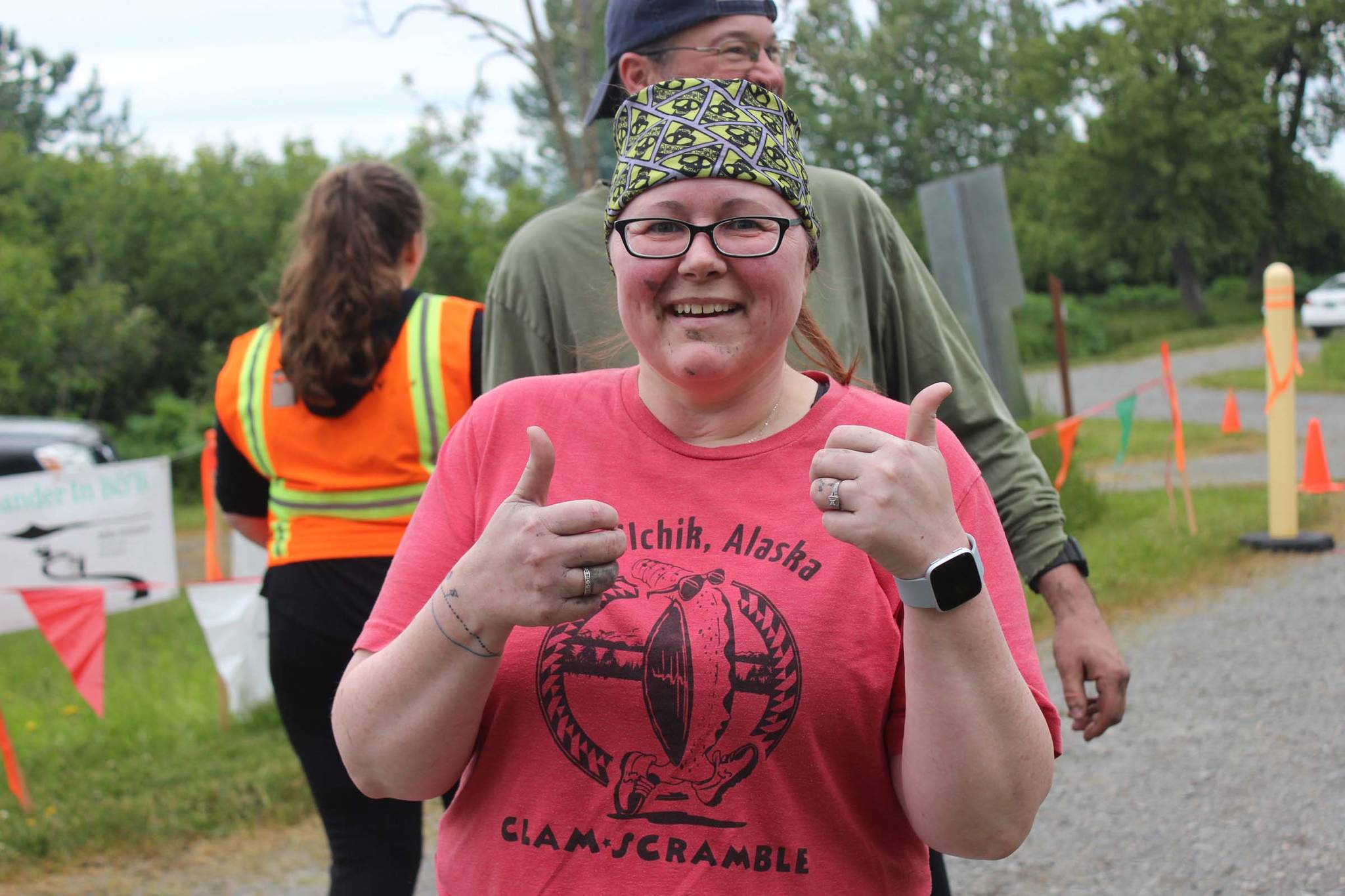 Starla Franklin gives a thumbs-up after crossing the finish line of the 2019 5K Clam Scramble on Saturday, June 15, 2019, in Ninilchik, Alaska. (Photo by McKibben Jackinsky)