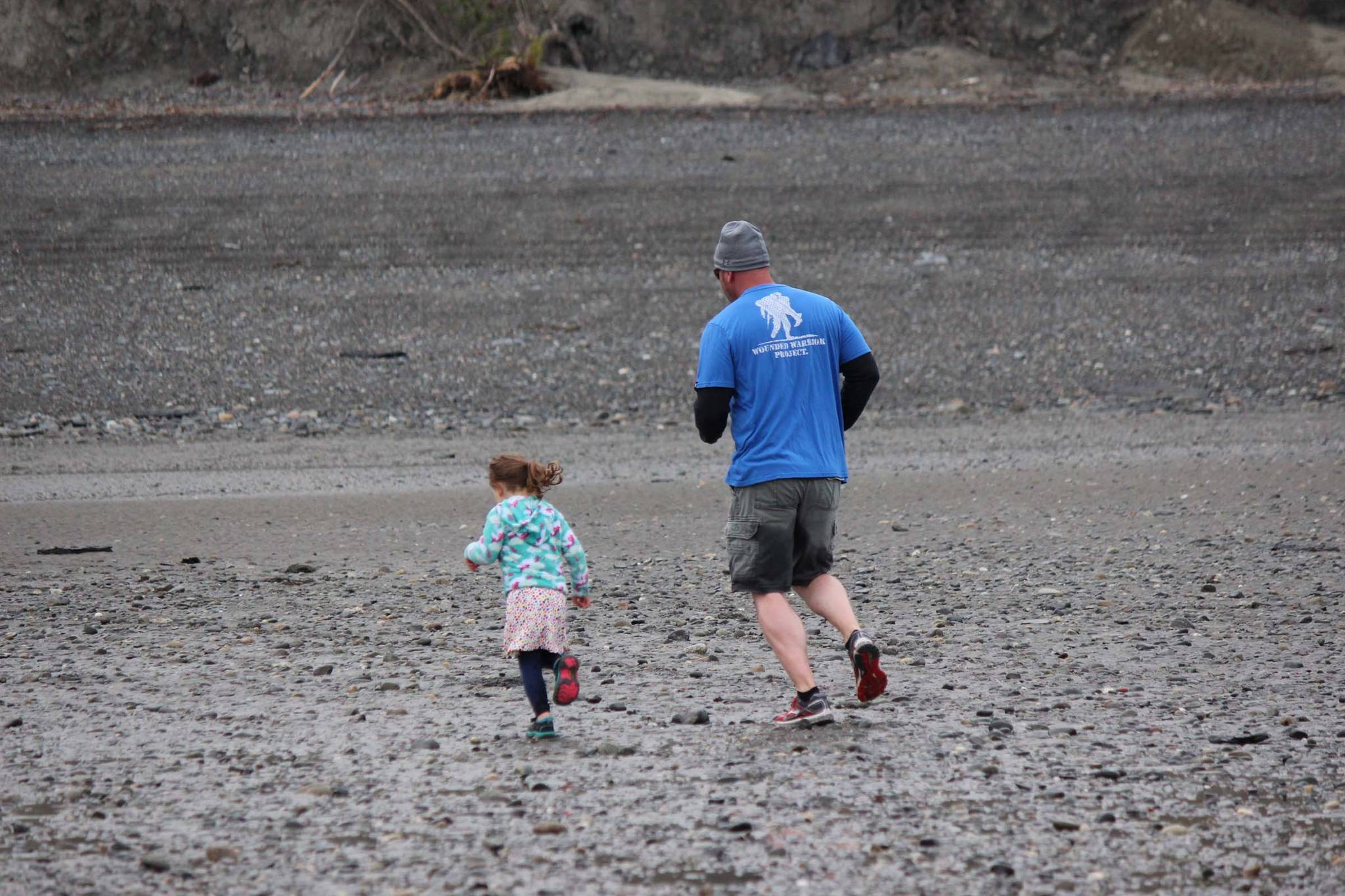Sara Reynolds, 3, didn’t let age keep her out of the 5K Clam Scramble held Saturday, June 15, 2019 in Ninilchik, Alaska. Although too young to officially register for the fun run, the determined youngster ran beside her father, Jeff Reynolds. Not pictured are Sarah’s mom, Tasha, and older sister, Avilyn, who also participated. (Photo by McKibben Jackinsky)
