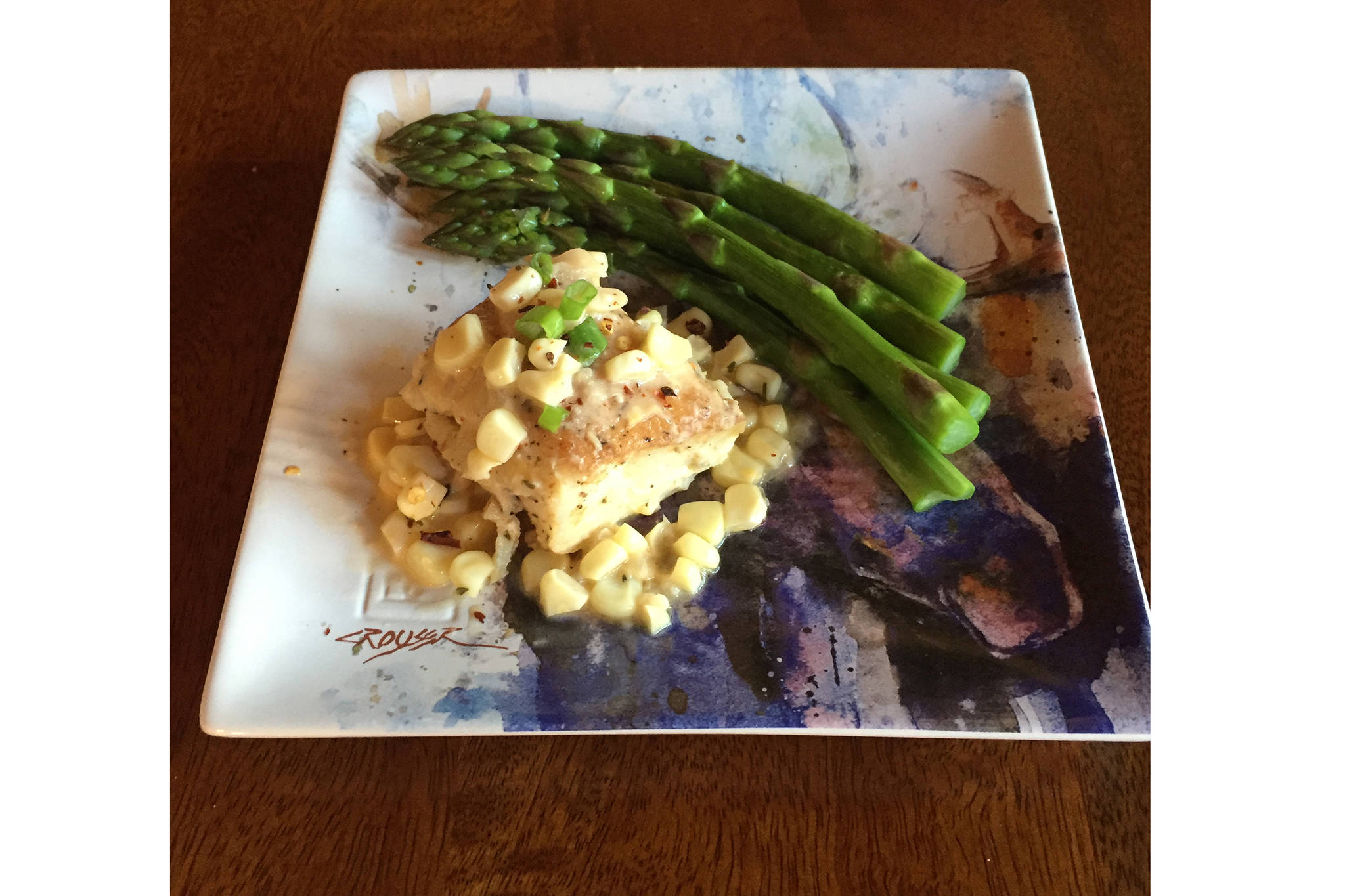 Corn in this recipe of roasted halibut with corn chardonnay butter sauce complements the taste of halibut, as prepared here on June 25, 2019, in Teri Robl’s kitchen in Homer, Alaska. (Photo by Teri Robl)