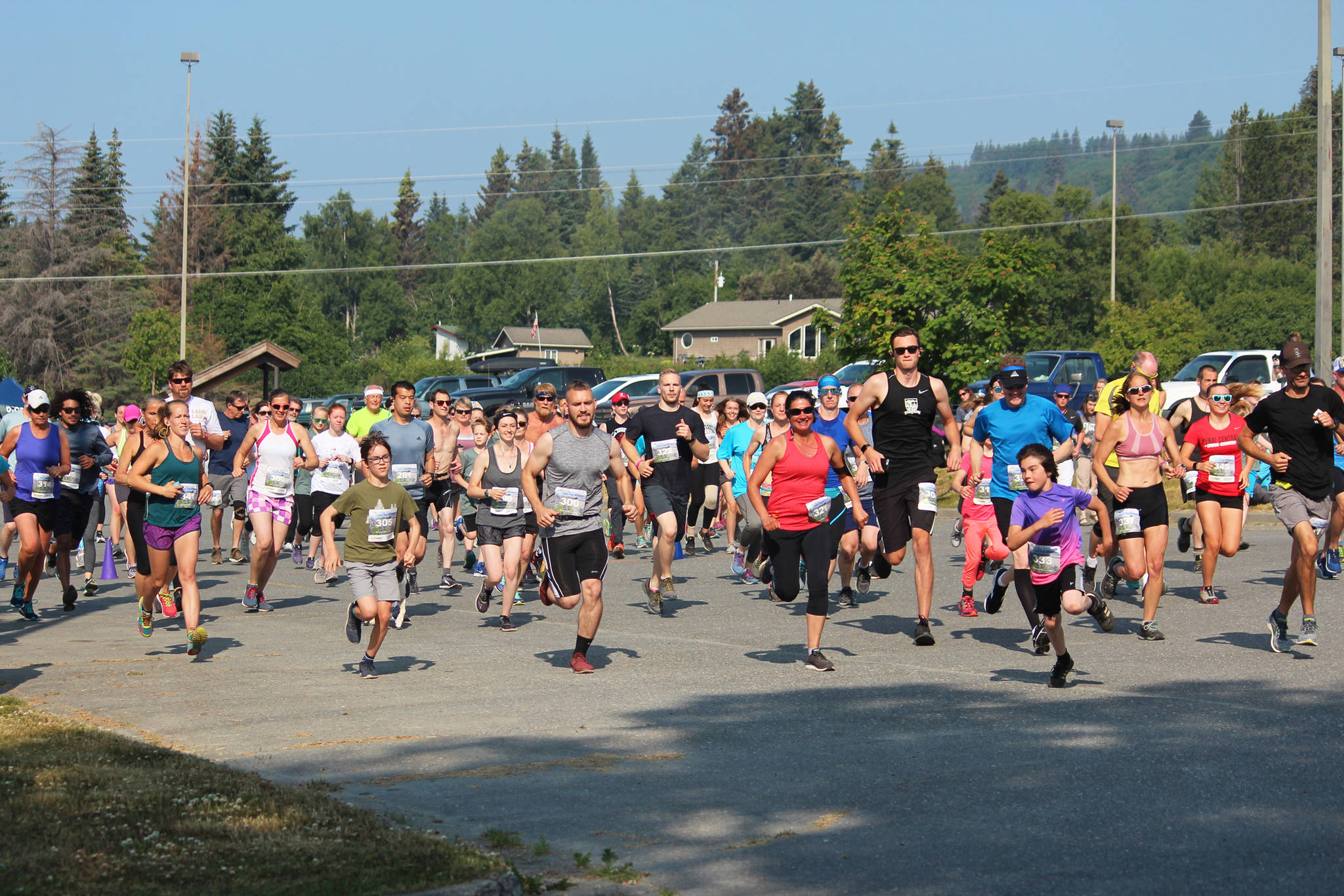Participants in this year’s Spit Run 10k to the Bay take off from the starting line at Homer High School on Saturday, June 29, 2019 in Homer, Alaska. (Photo by Megan Pacer/Homer News)