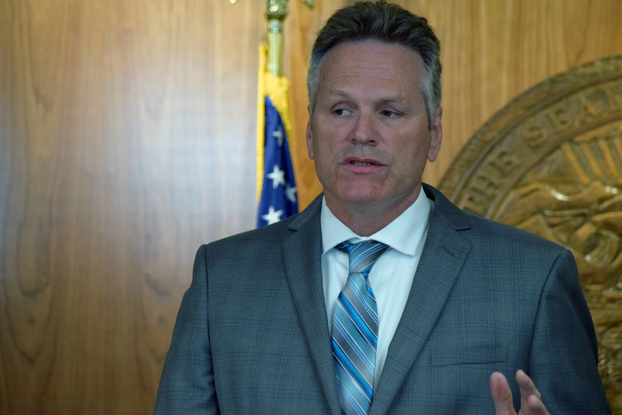 Gov. Mike Dunleavy speaks during a press conference to announce more than $400 million in line-item vetoes to the Legislature-approve budget, Friday, June 28, 2019. (Ben Hohenstatt | Juneau Empire)