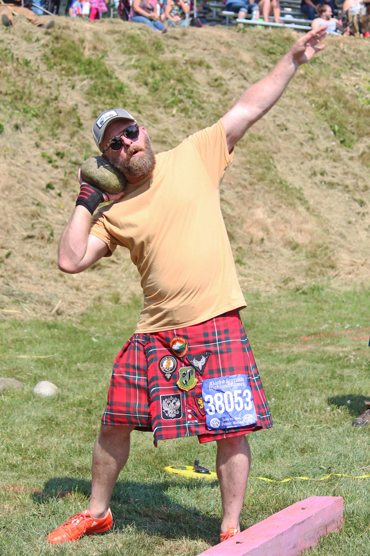Photos by Megan Pacer | Homer News                                Dan Gregory of Boise, Idaho prepares to throw a Braemar stone during the Braemar stone put event of the Kachemak Bay Highland Games, held Saturday, July 6, at Karen Hornaday Park in Homer.