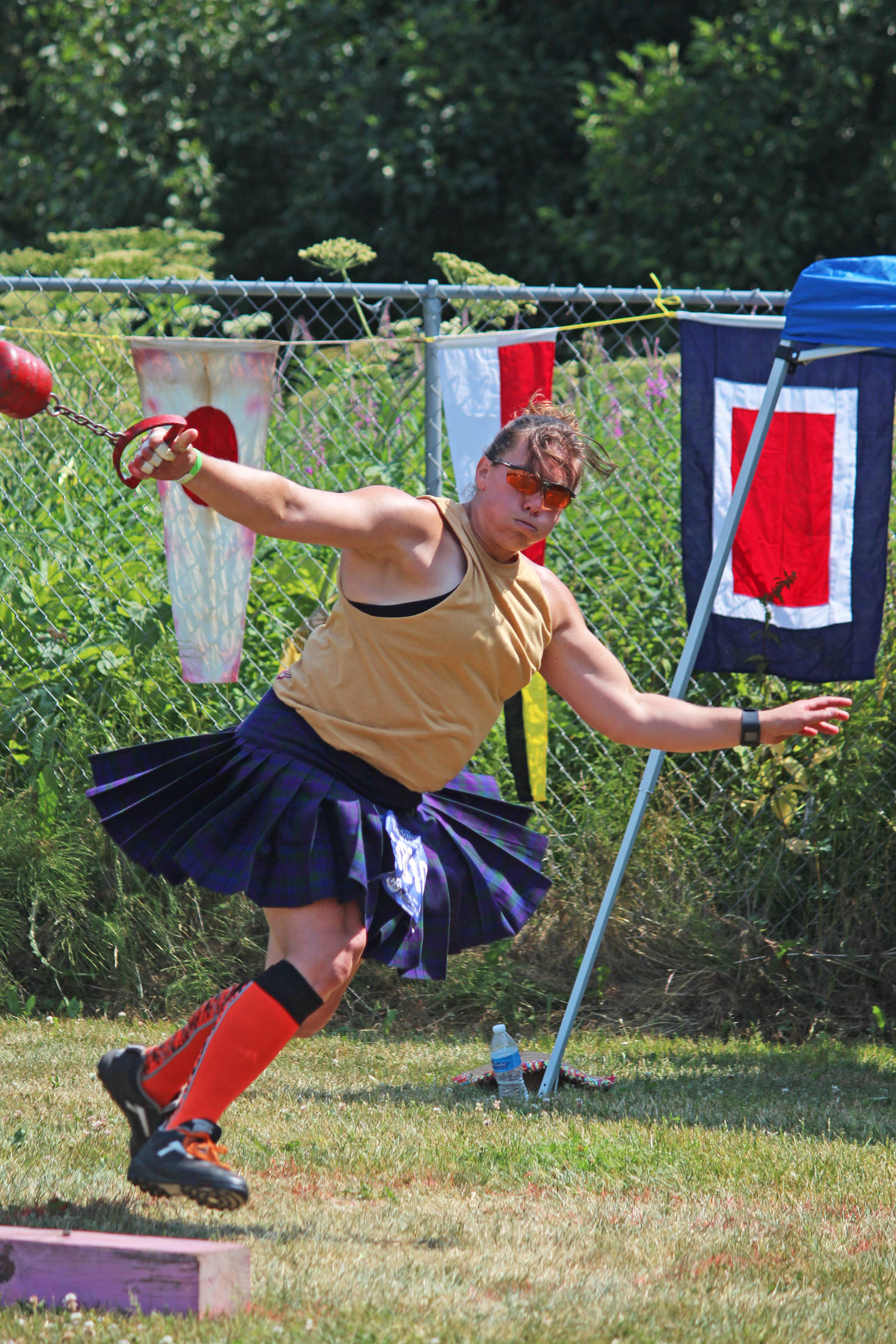 Chrystal Rubert winds up to throw a weight during the women’s weight throw for distance event at this year’s Kachemak Bay Highland Games held Saturday, July 6, 2019 at Karen Hornaday Park in Homer, Alaska. Rubert took first place in the Women’s Open division. (Photo by Megan Pacer/Homer News)