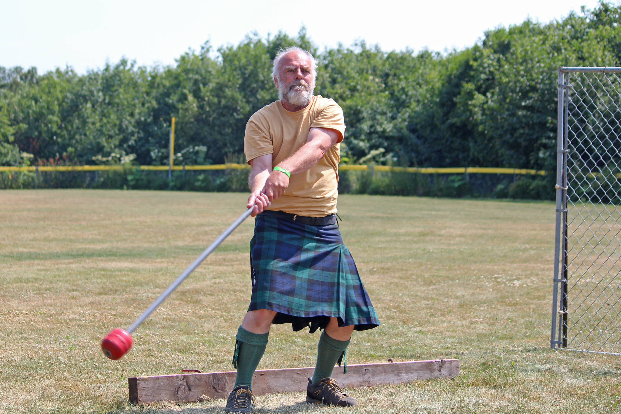 A competitor prepares to throw a hammer in the men’s hammer throw event at the Kachemak Bay Highland Games, held Saturday, July 6, 2019 at Karen Hornaday Park in Homer, Alaska. (Photo by Megan Pacer/Homer News)