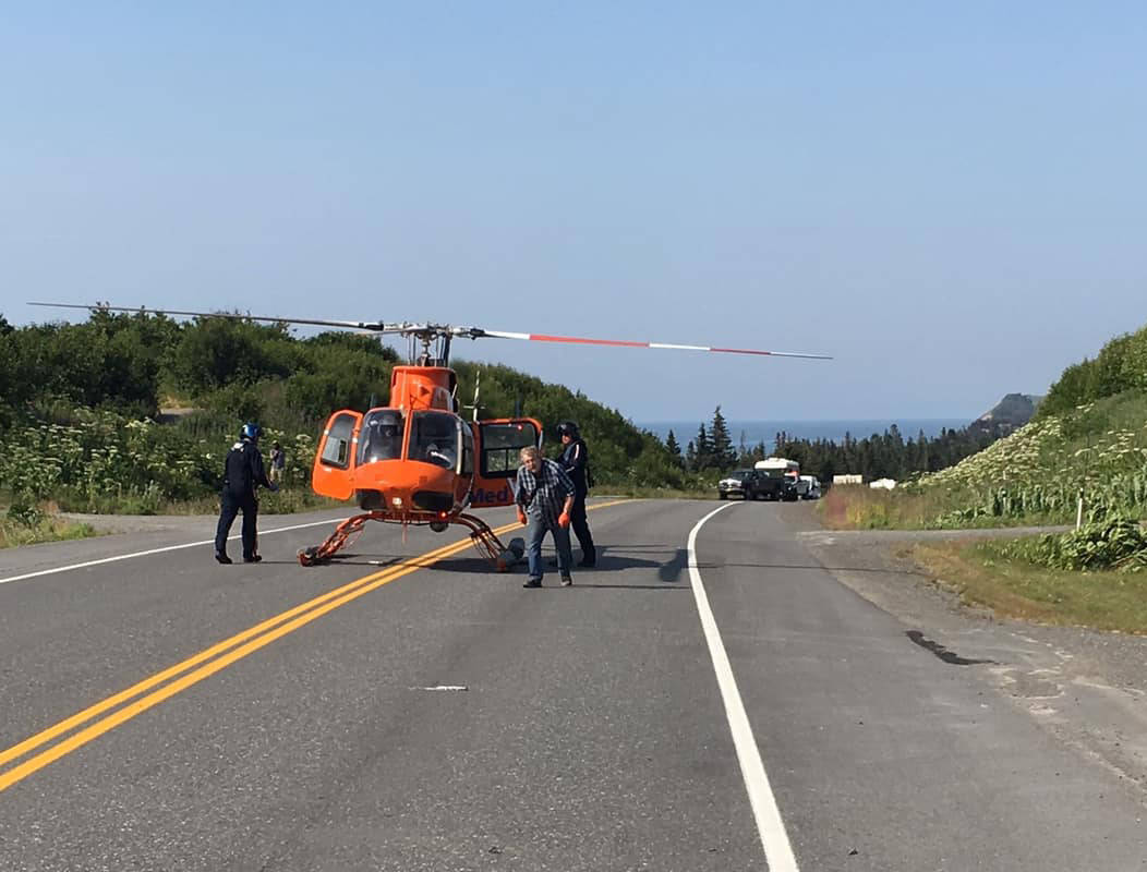 Crews in a LifeMed helicopter prepare to transport a victim of a two-vehicle fatal car crash on July 7, 2019, near Mile 142 Sterling Highway, Happy Valley, Alaska. The driver of one car involved in the crash, Michael Franklin, 18, of Palmer, Alaska, died of his injuries at the scene. (Photo by Jon Marsh/Anchor Point Fire and EMS)