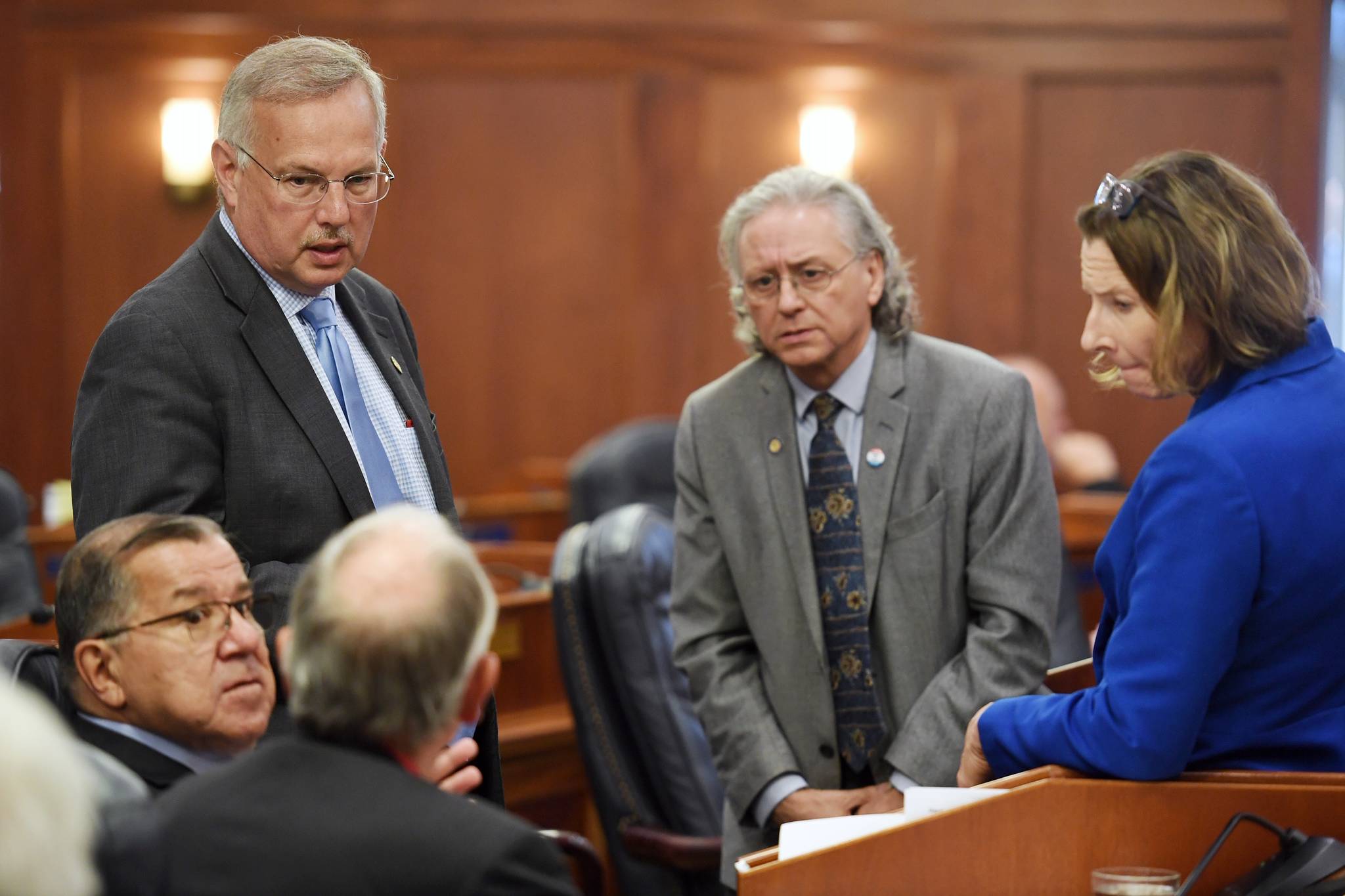 Speaker of the House Rep. Bryce Edgmon, I-Dillingham, left, and Senate President Cathy Giessel, R-Anchorage, right, speaks with Senate and House Leaders during a Joint Session at the Capitol on Wednesday, July 10, 2019. (Michael Penn | Juneau Empire)