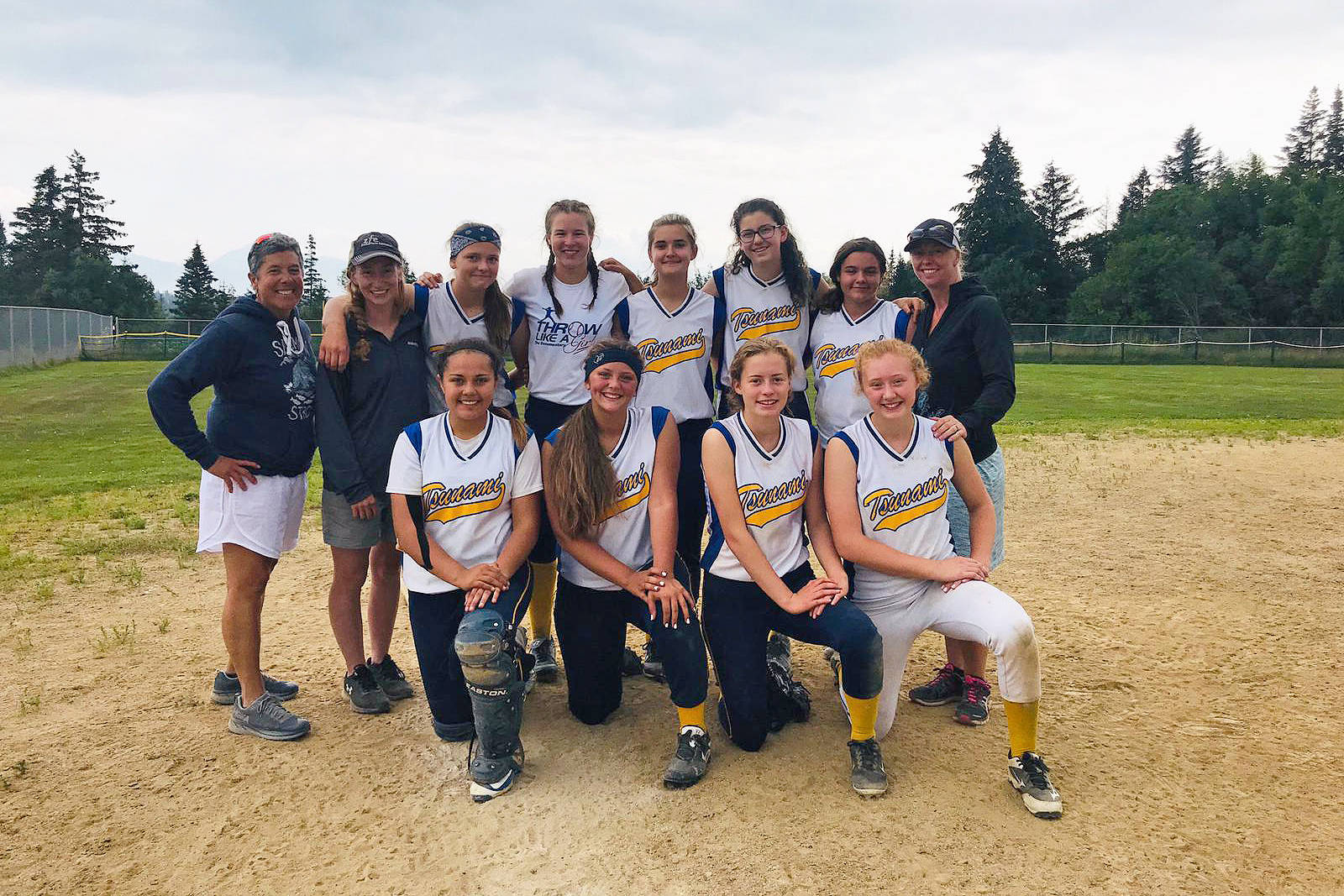 Members of the Tsunami youth softball team pose for a photo on Sunday, Aug. 21, 2019 after a round robin tournament last weekend at Jack Gist Park in Homer, Alaska. (Photo by Monica Anderson)